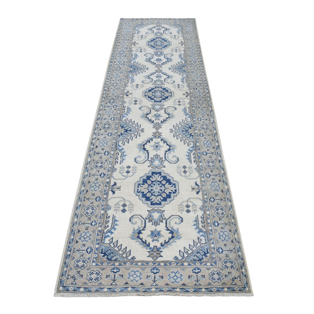 Ivory Kazak pure wool hand knotted vintage look rug 2'9"x10'7".: Ivory Kazak pure wool hand knotted vintage look rug 2'9"x10'7". Experience the timeless elegance of a vintage Kazak rug, hand-knotted in rich ivory wool and boasting an authentic Afghan regional