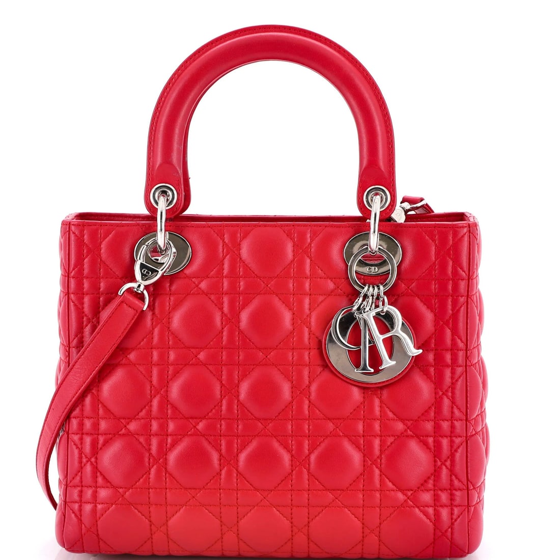 Christian Dior Lady Dior is a medium lambskin bag with cannage quilt.: Christian Dior Lady Dior is a medium lambskin bag with cannage quilt. The iconic Lady Dior bag from Christian Dior is a timeless treasure, boasting a stunning pink lambskin exterior adorned with
