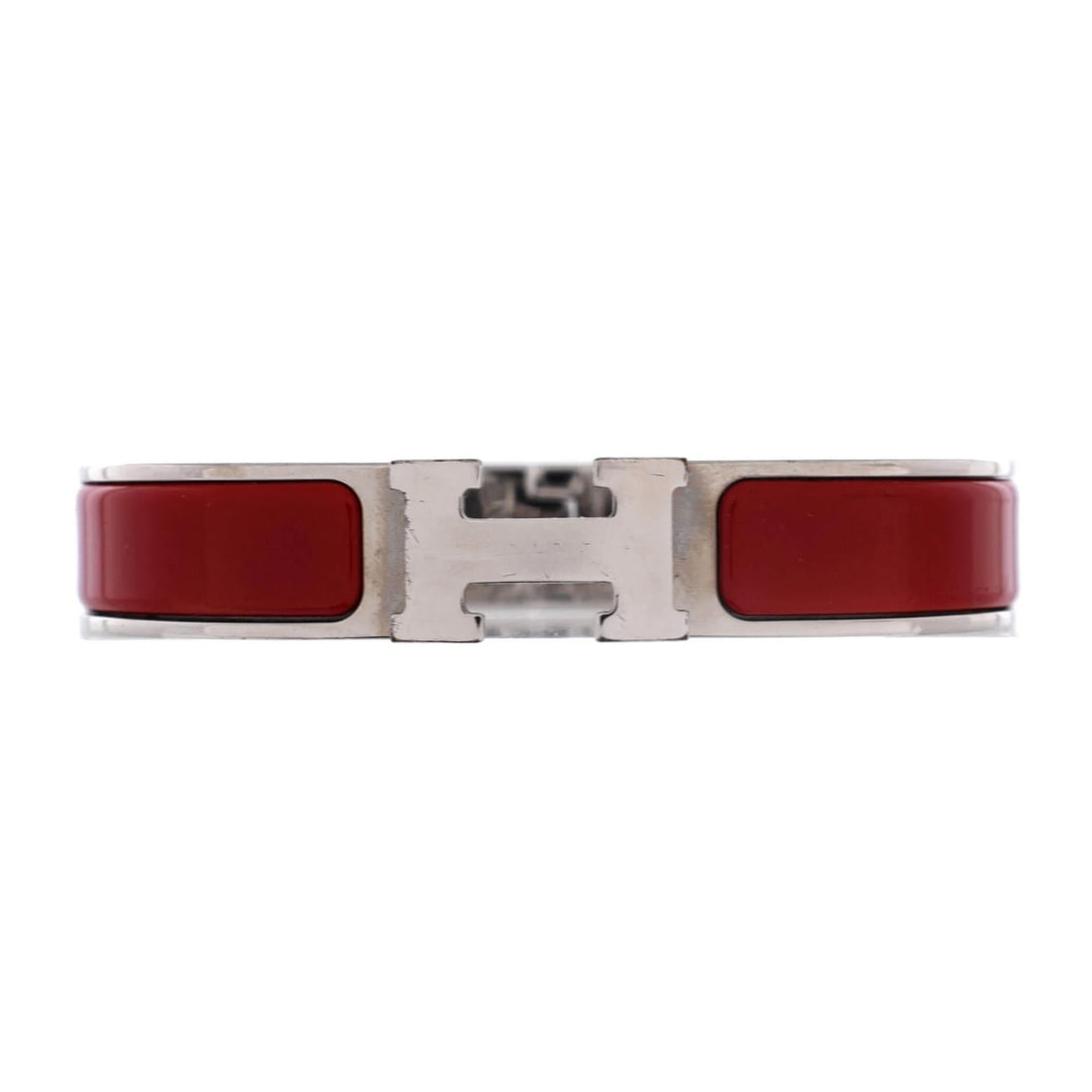 Hermes Clic Narrow Enamel Bracelet: Hermes Clic Narrow Enamel Bracelet The Hermes Clic Narrow Enamel Bracelet is a striking accessory that combines bold red enamel with sleek silver accents, creating a vibrant and eye-catching look.