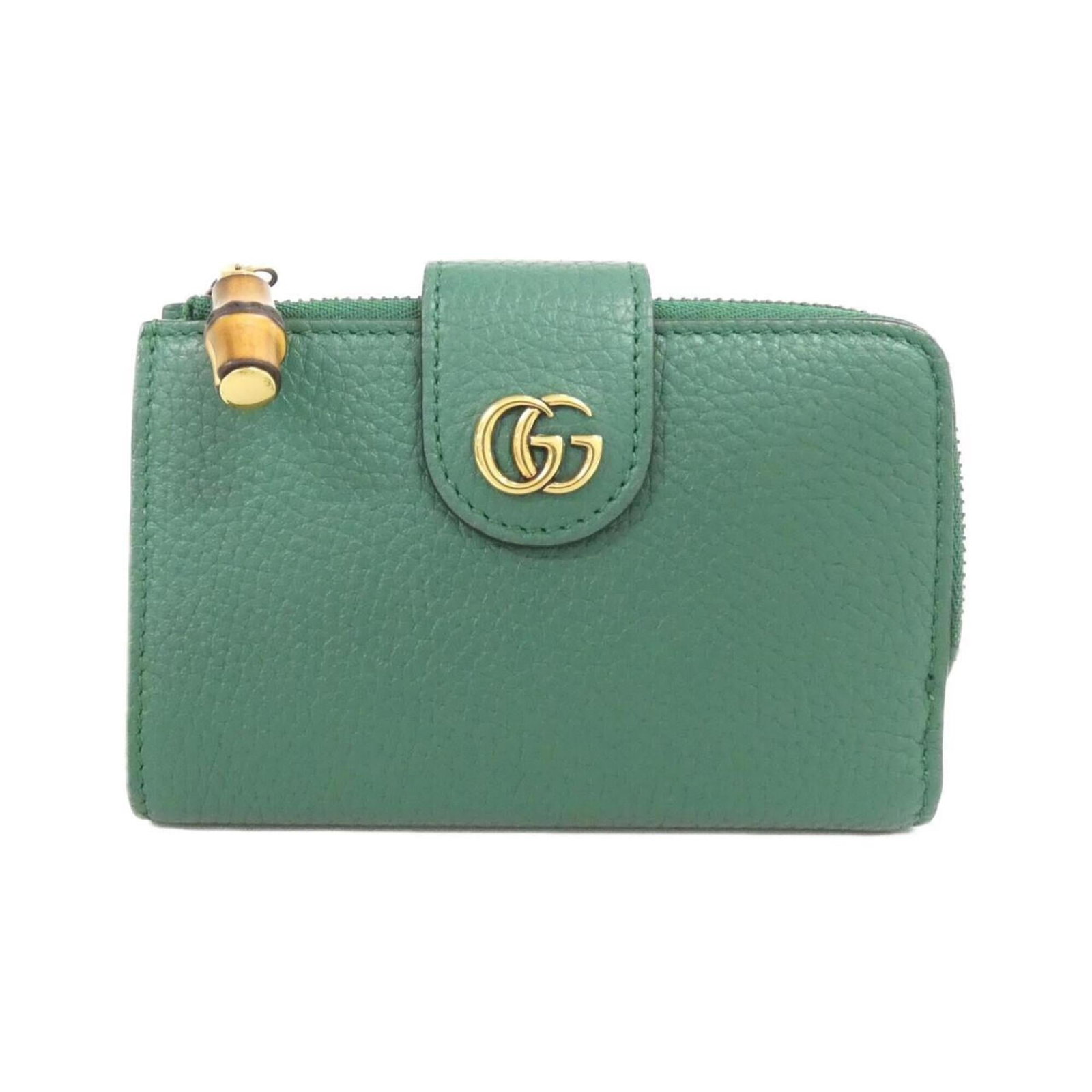 Gucci leather bi-fold wallet: Gucci leather bi-fold wallet A stunning emerald green Gucci bi-fold wallet, crafted from rich leather and boasting a sleek, sophisticated design. With its classic bi-fold layout and subtle scratches,