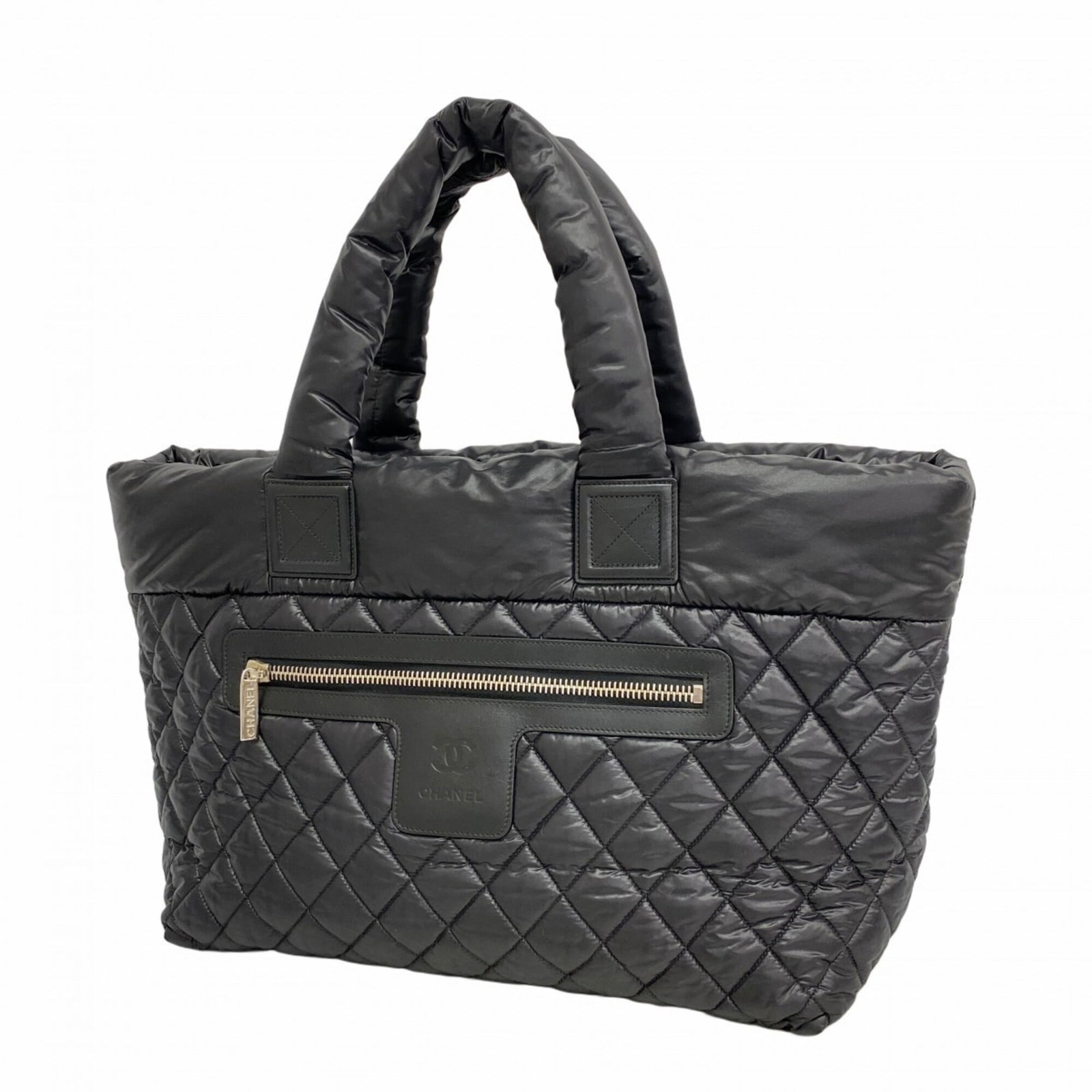 Chanel Tote Bag Nylon: Chanel Tote Bag Nylon A timeless Chanel tote in sleek black nylon, adorned with elegant silver hardware, adds a touch of sophistication to any outfit. With its classic design and durable construction,