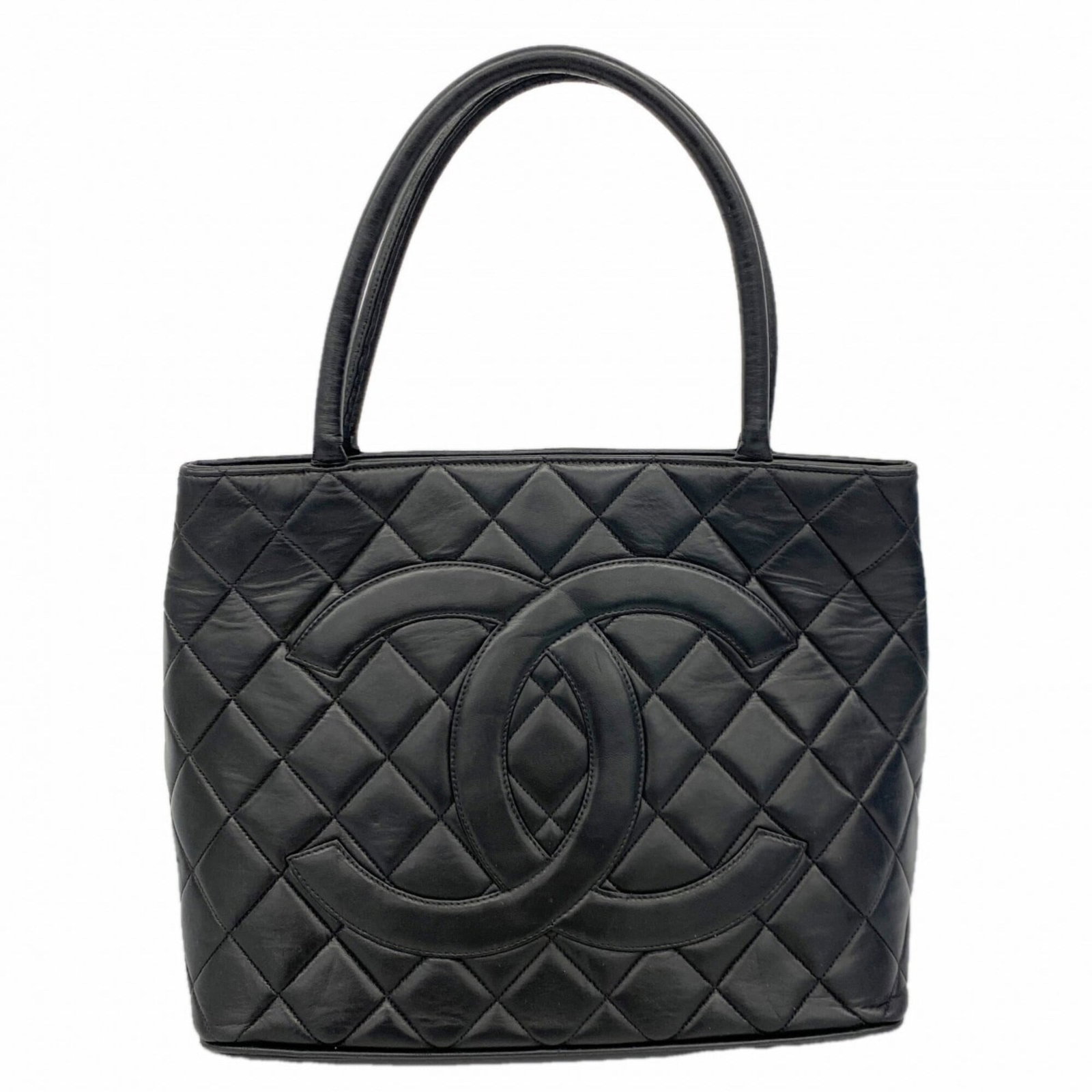 Chanel Tote Bag Leather: Chanel Tote Bag Leather A luxurious black Chanel tote bag made from premium lambskin leather, adorned with elegant gold hardware, is up for grabs. With its classic design and timeless appeal, this