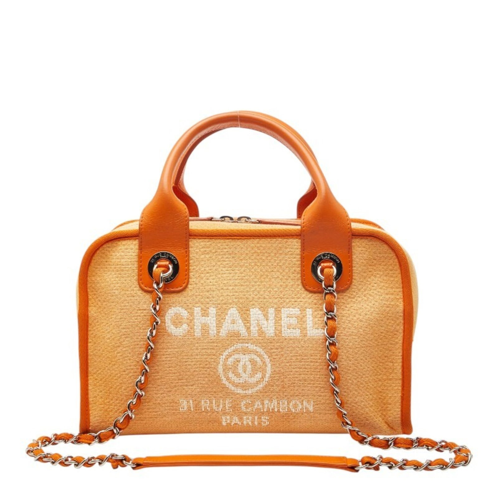 Leather canvas handbag by Chanel: Leather canvas handbag by Chanel A vibrant orange canvas and leather Chanel handbag, perfect for adding a pop of color to your everyday essentials. With its classic design and timeless style, this pre