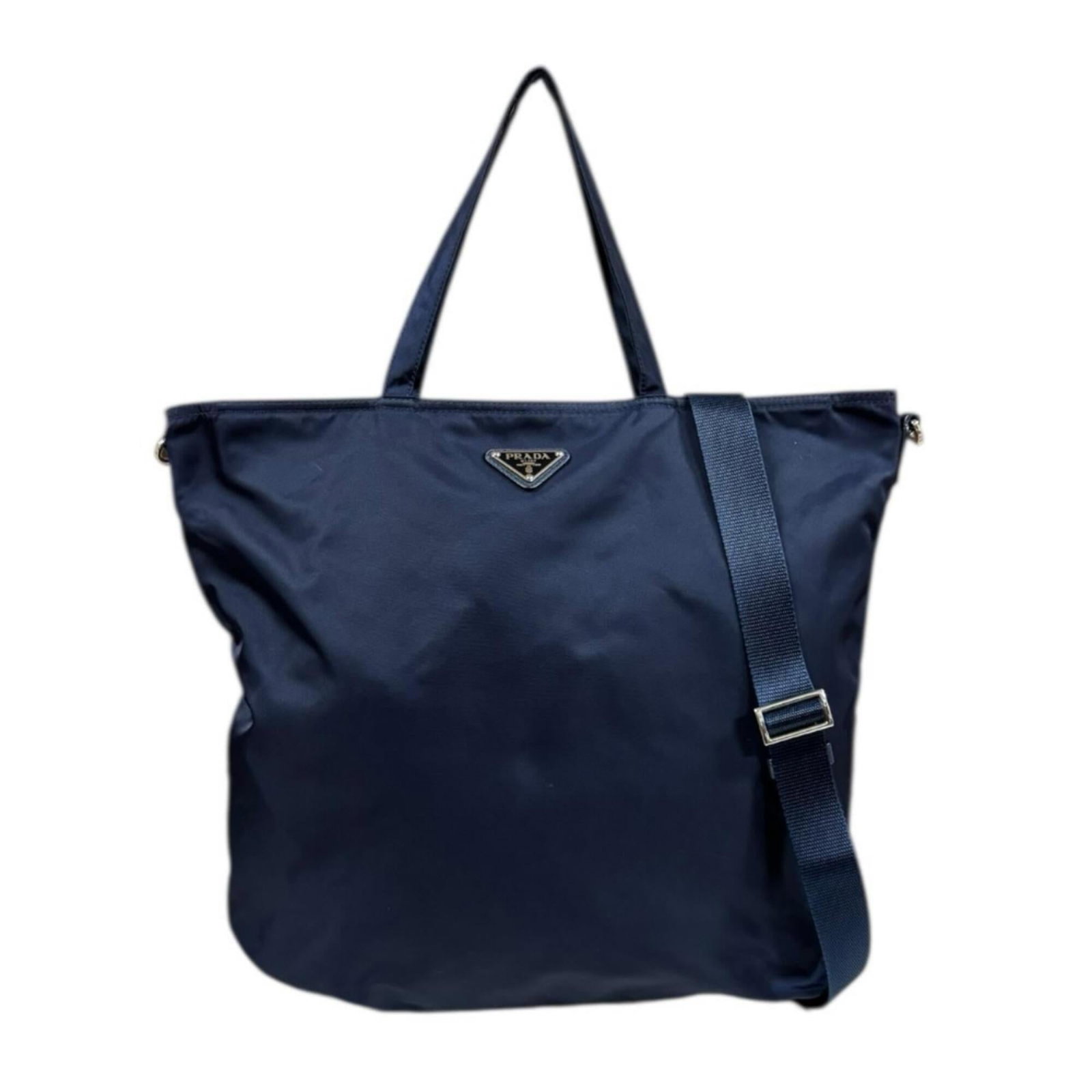 Prada nylon shoulder bag: Prada nylon shoulder bag A sleek and sophisticated Prada nylon shoulder bag, perfect for adding an air of elegance to any outfit. With its timeless navy color and durable nylon material, this stylish