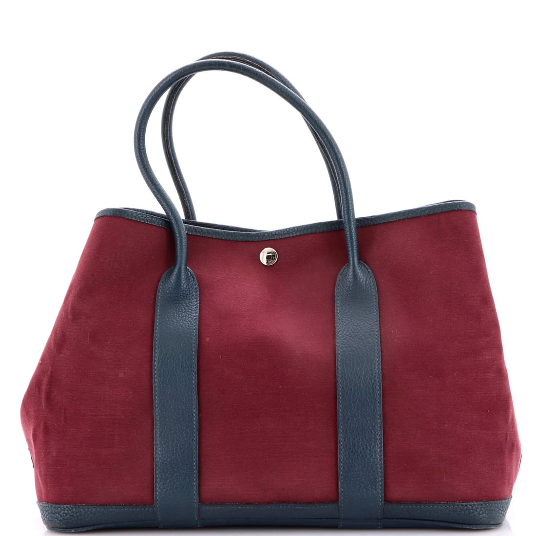 Hermes Leather Toile Garden Party Tote: Hermes Leather Toile Garden Party Tote A vibrant and elegant Herm?s Garden Party Tote in striking red leather, adorned with the iconic Toile de Jouy print, adds a pop of color to any outfit. With its