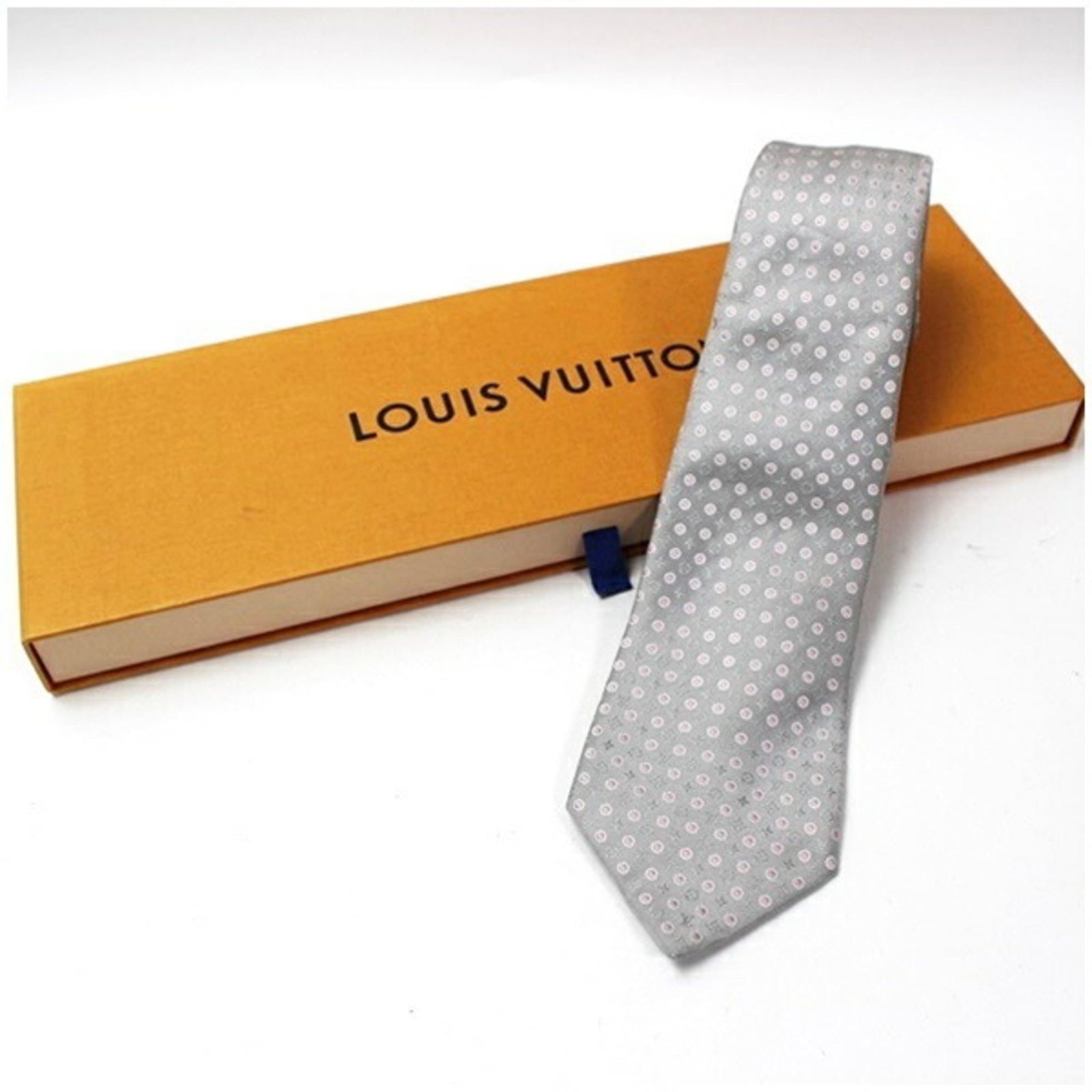 Silk cravat by Louis Vuitton: Silk cravat by Louis Vuitton A luxurious touch for the modern gentleman, this Louis Vuitton silk cravat boasts a sleek gray and pink color combination that exudes sophistication. Made from high-qualit