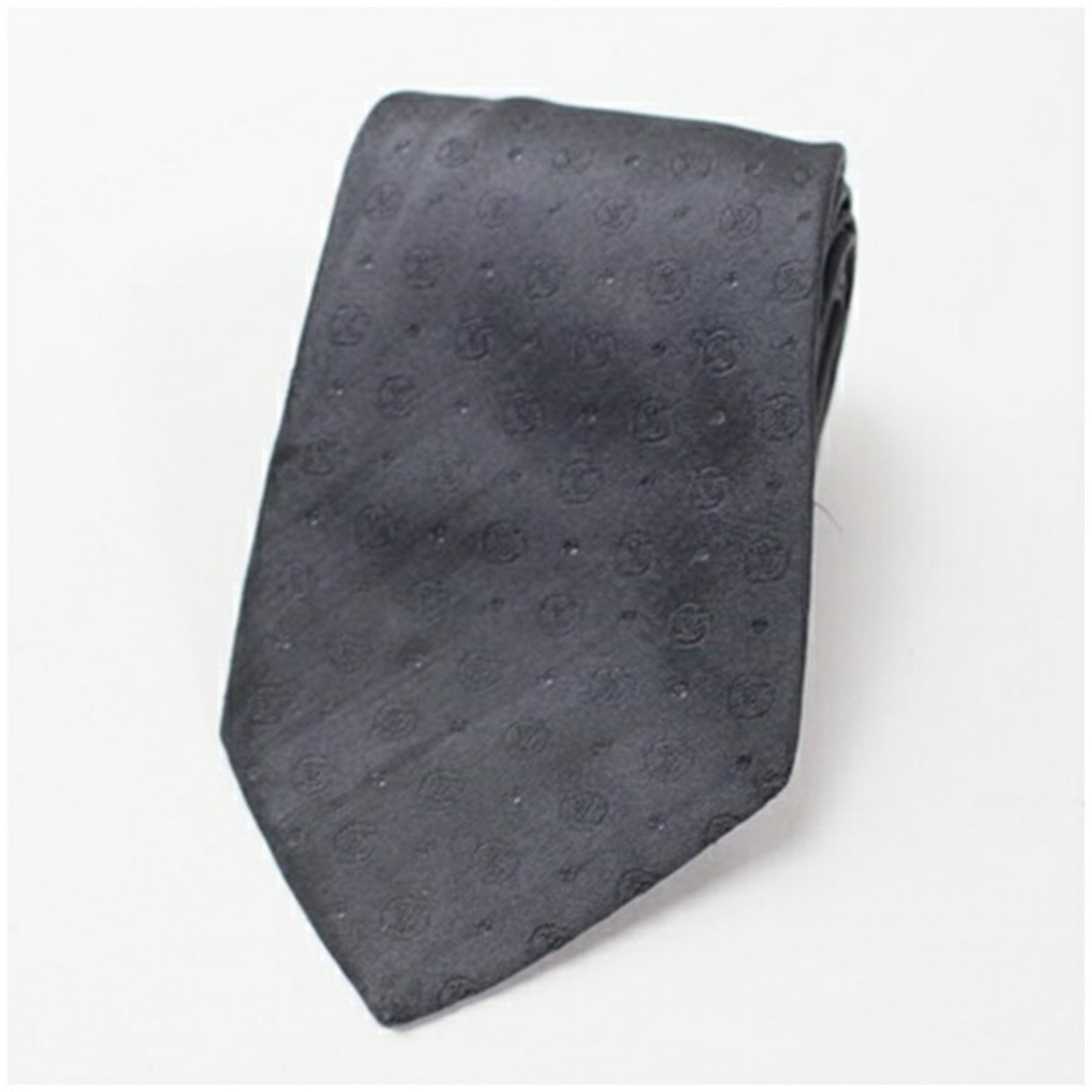Silk cravat by Louis Vuitton: Silk cravat by Louis Vuitton A luxurious touch for any formal occasion, this pre-owned Louis Vuitton silk cravat boasts the iconic brand's signature monogram pattern in a sophisticated gray hue. Made