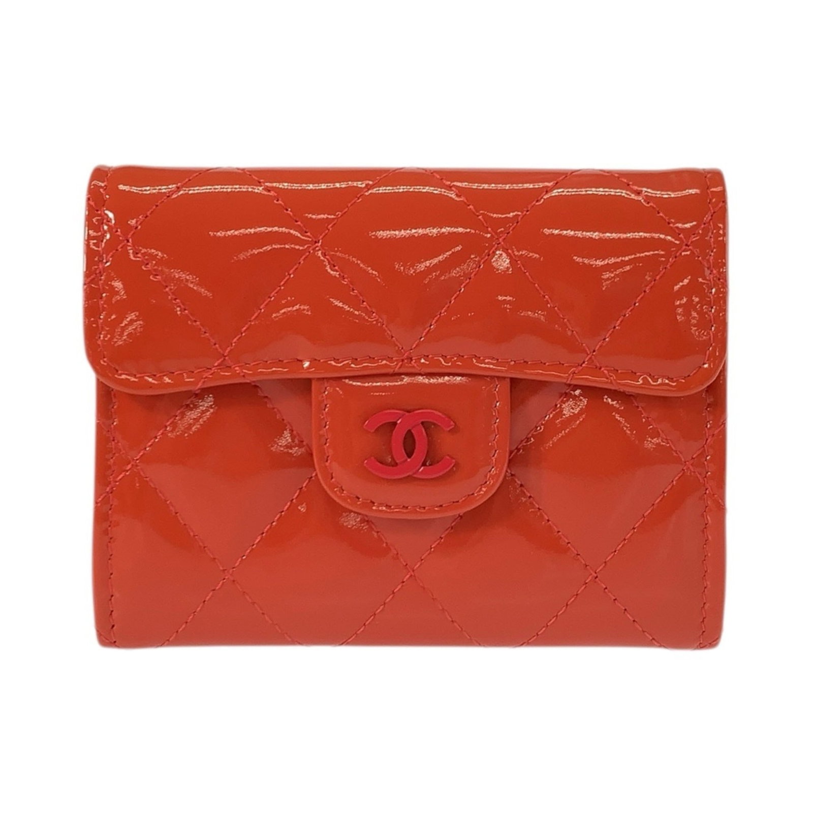 Chanel Business Card Case in Patent Leather: Chanel Business Card Case in Patent Leather A vibrant orange Chanel business card case in patent leather adds a pop of personality to any professional setting. With its sleek design and durable materi