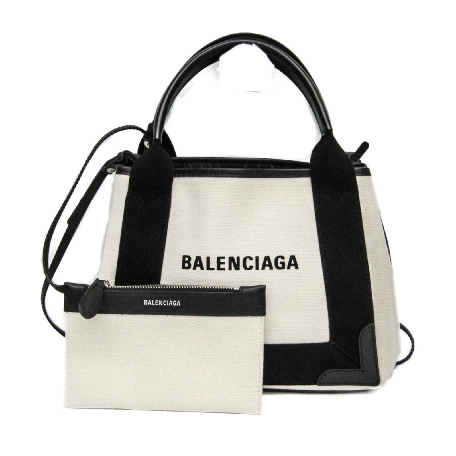 Canvas leather shoulder bag by Balenciaga: Canvas leather shoulder bag by Balenciaga A sleek and sophisticated shoulder bag from Balenciaga, crafted with premium canvas and supple leather in a timeless black and cream color combination. The