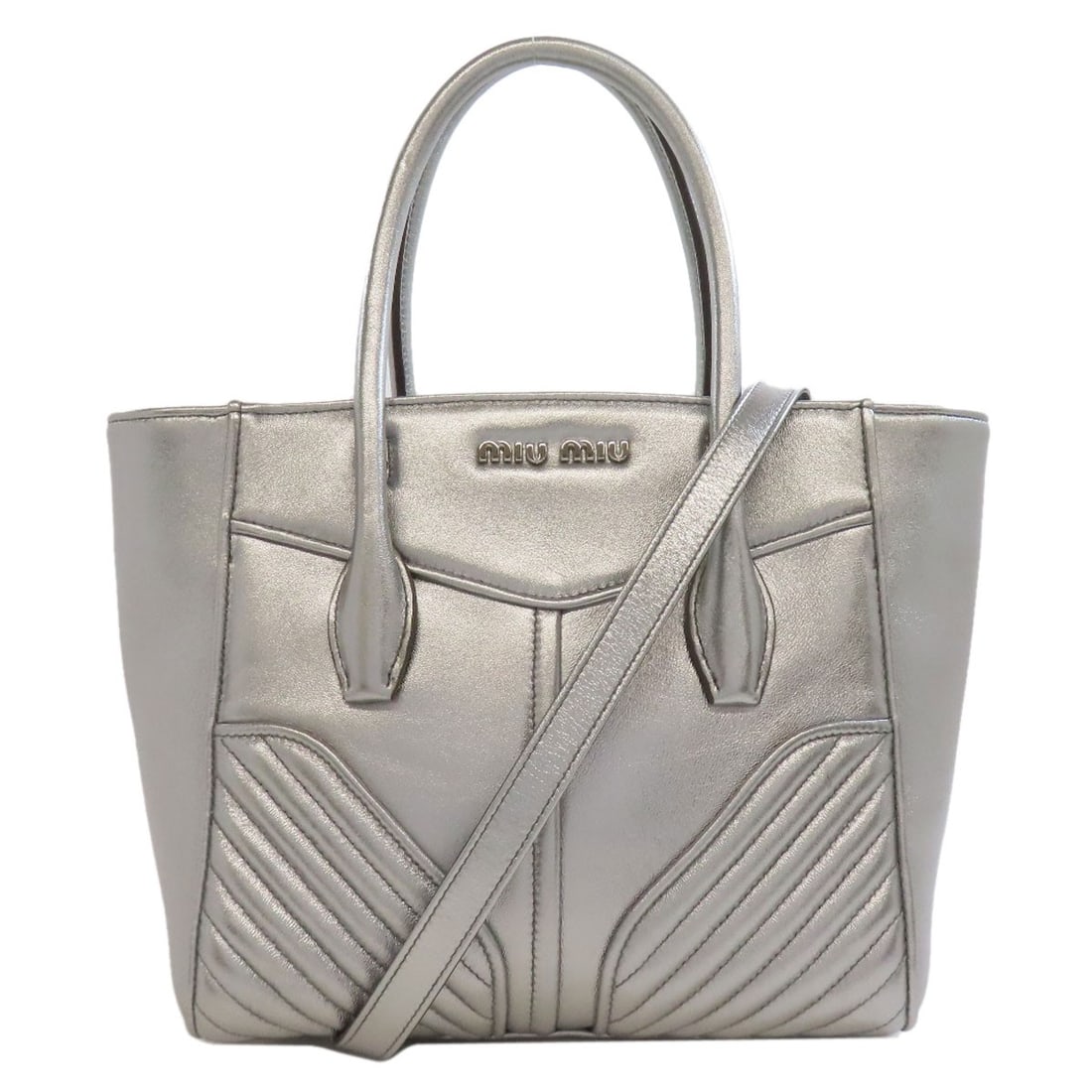 MIUMIU 2WAY Handbag Calf: MIUMIU 2WAY Handbag Calf Elevate your style with the sleek and sophisticated MIUMIU 2WAY Handbag, crafted from luxurious calf leather in a stunning silver finish. This Italian design masterpiece