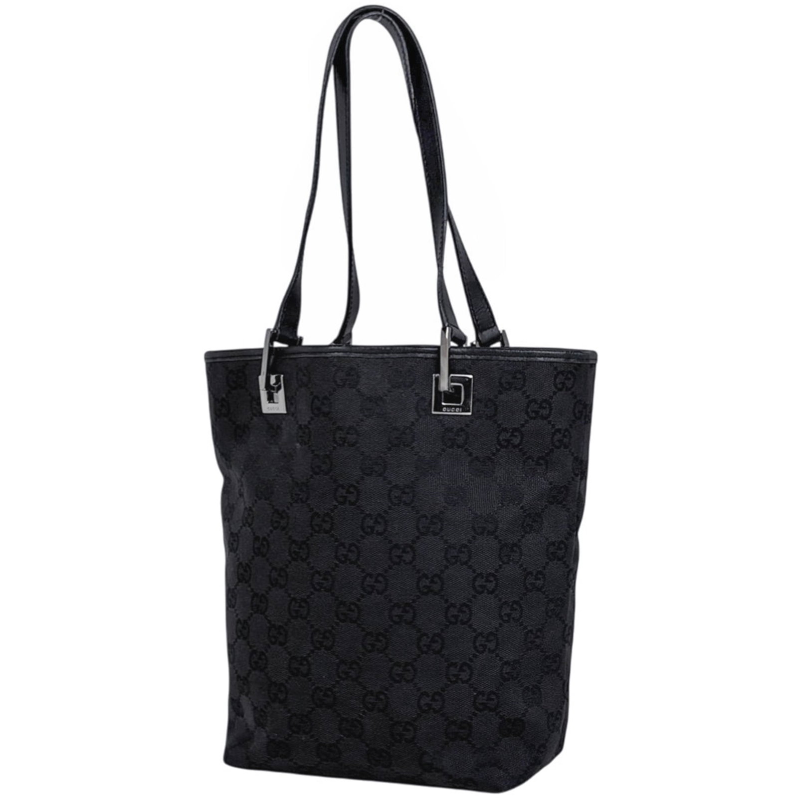 Gucci canvas tote bag: Gucci canvas tote bag A timeless Gucci canvas tote bag in sleek black, perfect for daily errands and weekend outings alike. With its classic design and durable GG canvas material, this stylish bag