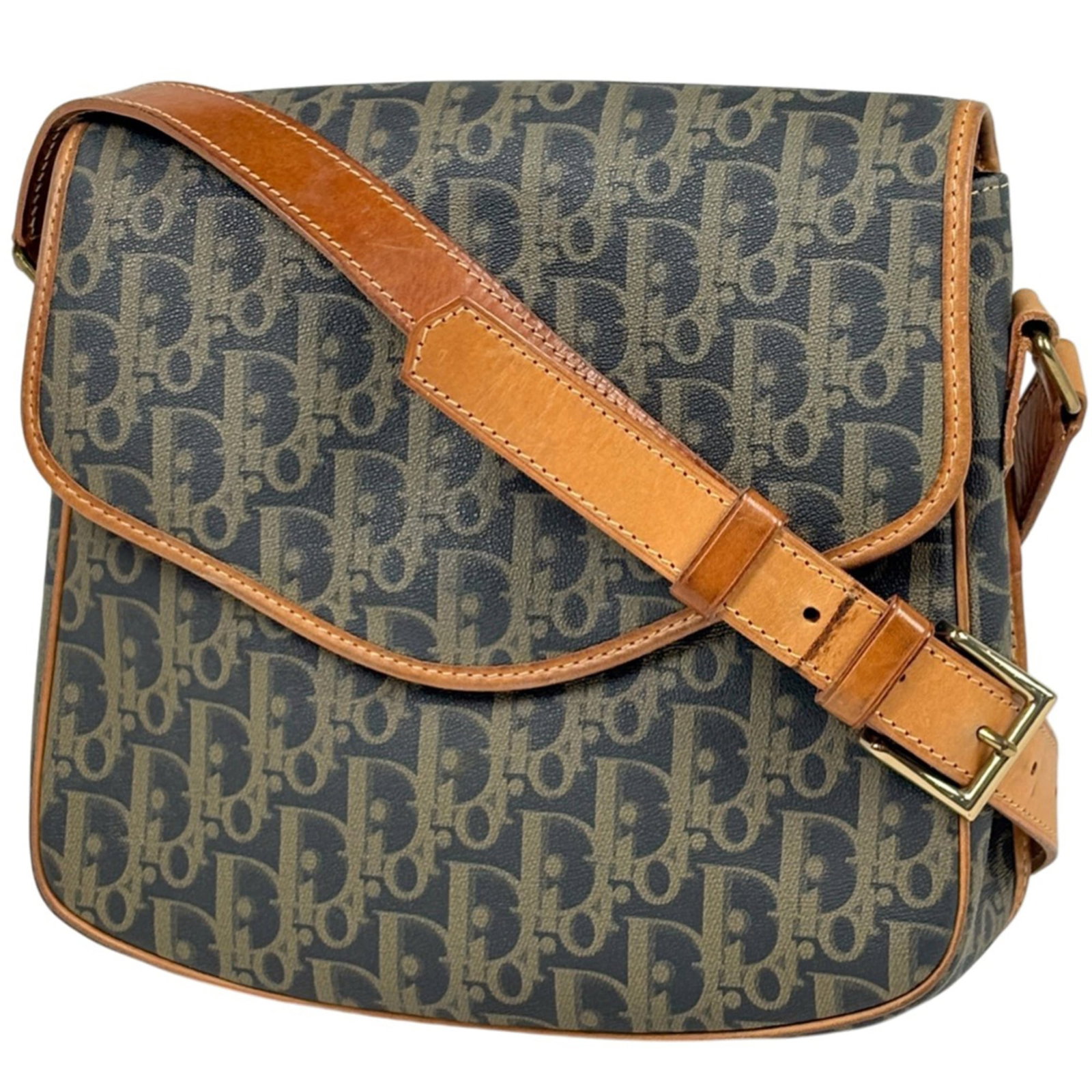 Christian Dior leather coated canvas shoulder bag: Christian Dior leather coated canvas shoulder bag A timeless Christian Dior shoulder bag, crafted from luxurious coated canvas and adorned with rich leather accents, adds an air of sophistication to a