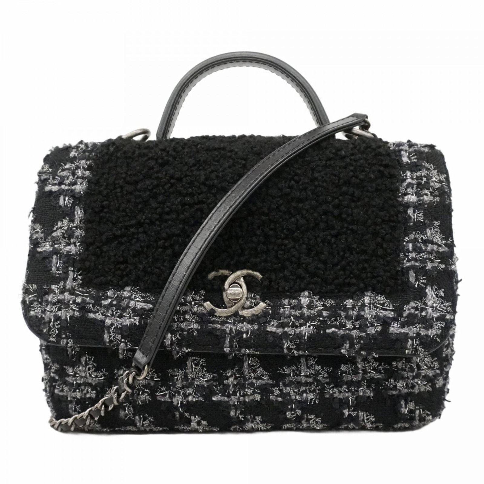 Chanel Handbag: Chanel Handbag A timeless Chanel handbag in sleek black and silver hardware, perfect for adding an air of sophistication to any outfit. With its classic design and compact size, this versatile bag is