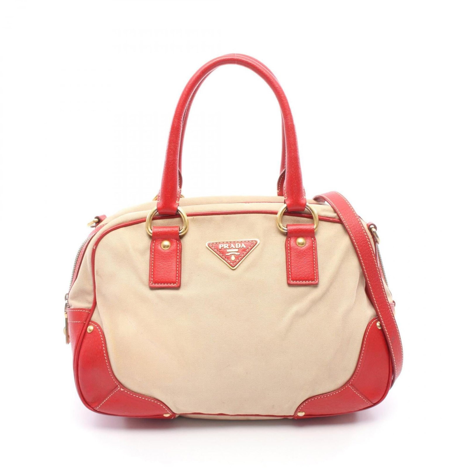 Prada Handbag Canvas, Leather: Prada Handbag Canvas, Leather A stylish and versatile Prada handbag, this canvas and leather tote boasts a chic beige and red color combination that adds a pop of personality to any outfit. With its s