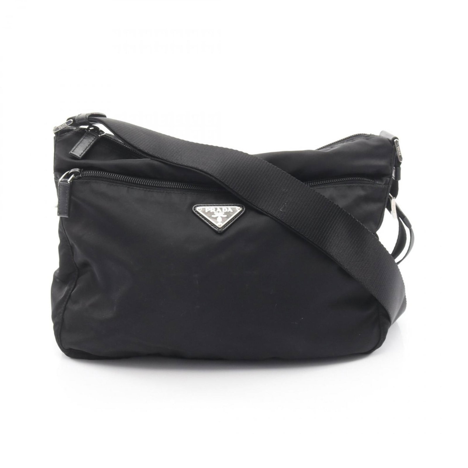 Nylon leather shoulder bag by Prada: Nylon leather shoulder bag by Prada A sleek and sophisticated shoulder bag from Prada, crafted with durable Saffiano leather and nylon accents for a modern touch. With its classic design and timeless