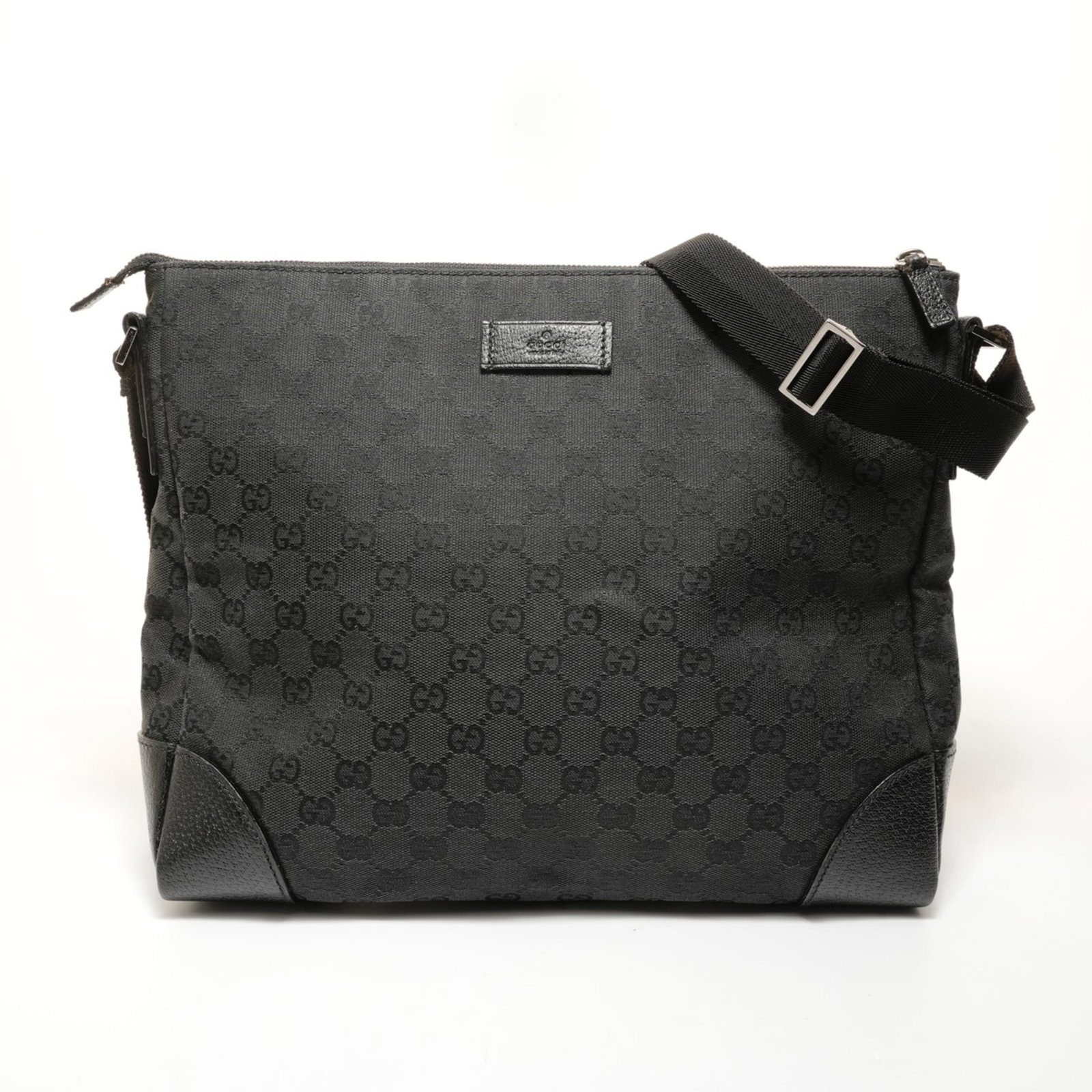 Gucci canvas shoulder bag: Gucci canvas shoulder bag A timeless Gucci canvas shoulder bag in sleek black, perfect for adding an air of sophistication to any outfit. With its spacious interior and adjustable strap length (65-120