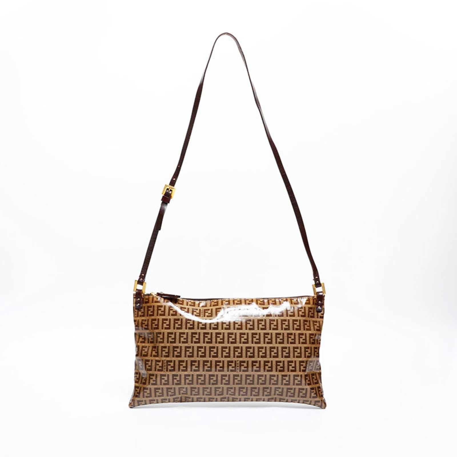 Fendi PVC shoulder bag: Fendi PVC shoulder bag A chic and edgy Fendi PVC shoulder bag, perfect for adding a touch of luxury to any outfit. With its signature brown color and durable PVC material, this iconic design is sure t