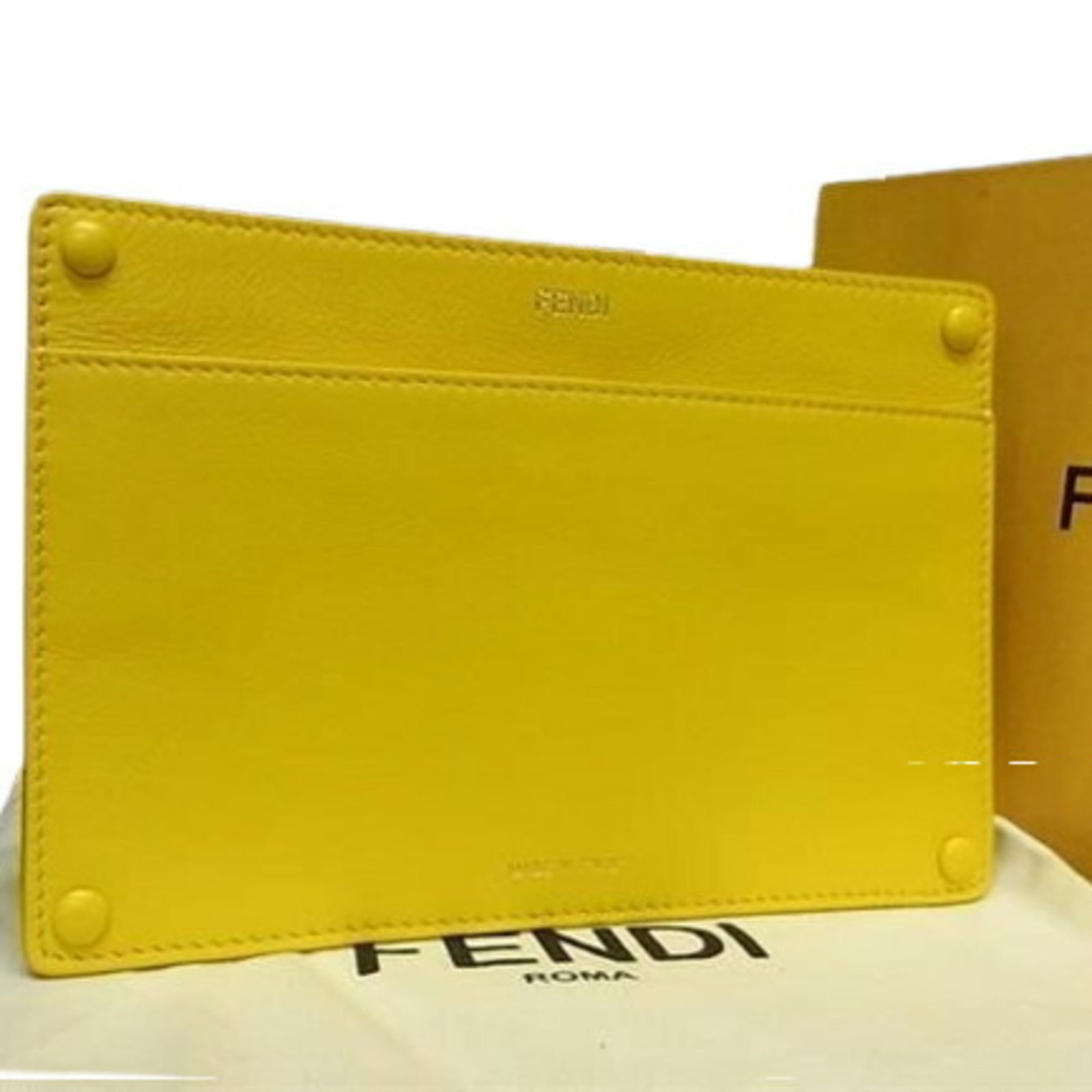 Fendi is a leather pouch.: Fendi is a leather pouch. A vibrant yellow leather pouch from the iconic Fendi brand, this stylish accessory boasts a sleek design and premium materials that exude luxury. In mint condition, it retain