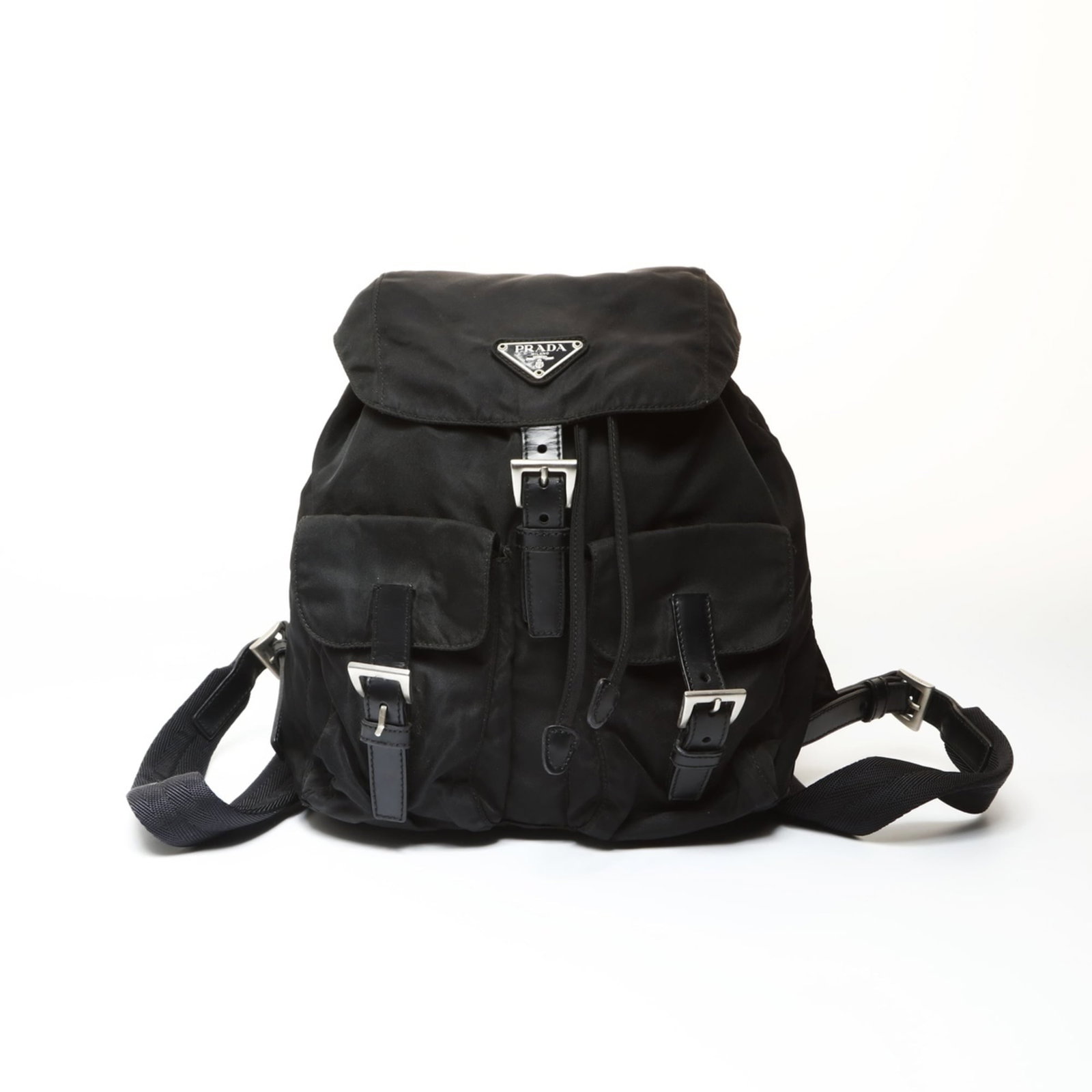 Nylon backpack from Prada: Nylon backpack from Prada A sleek and sophisticated Prada nylon backpack, perfect for the modern woman on-the-go. With its classic design, adjustable strap length, and durable nylon material, this sty