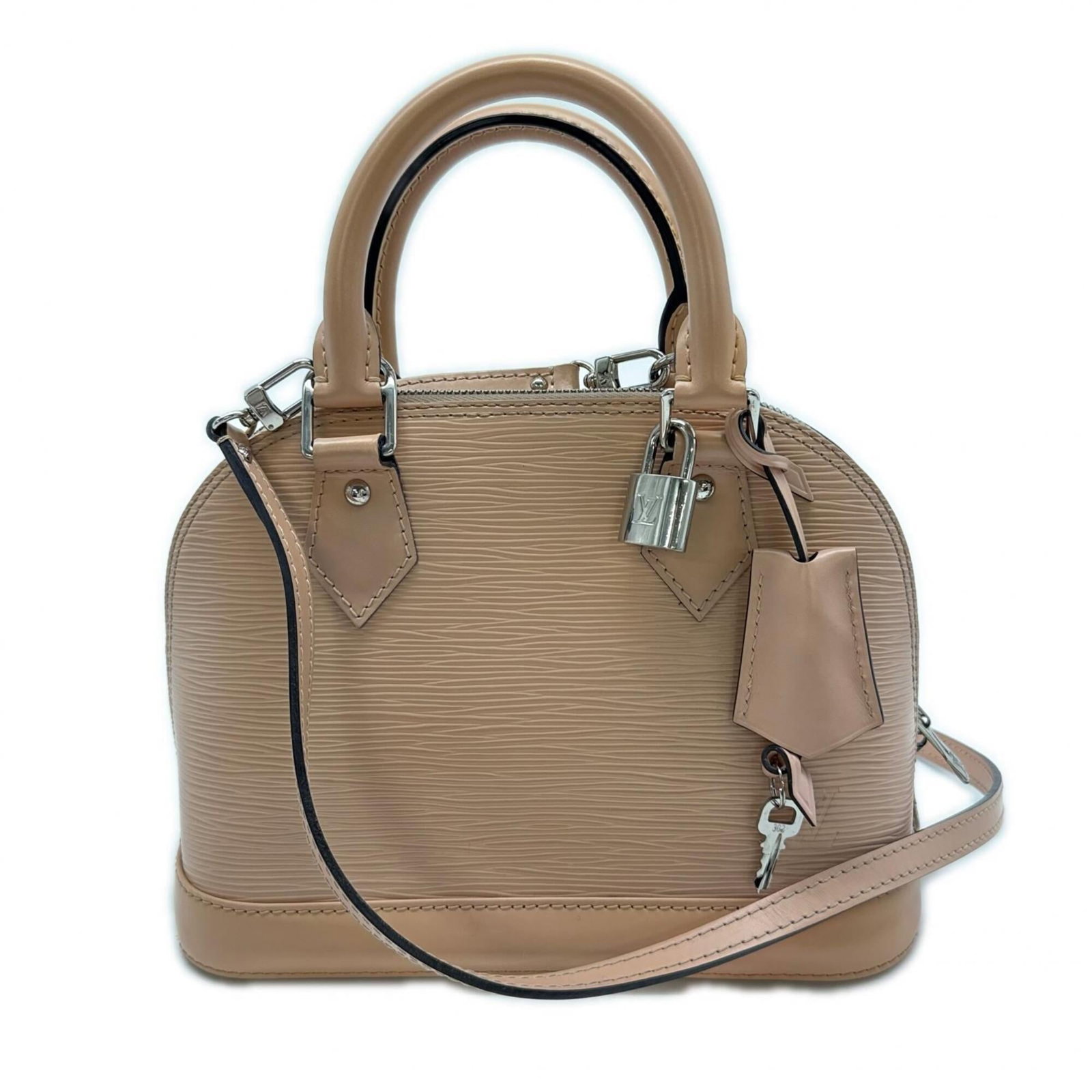 Louis Vuitton Leather Handbag: Louis Vuitton Leather Handbag A stunning Louis Vuitton leather handbag in soft pink beige, boasting classic LV monogram pattern and sleek design. With its sturdy 25cm handle and adjustable strap, this