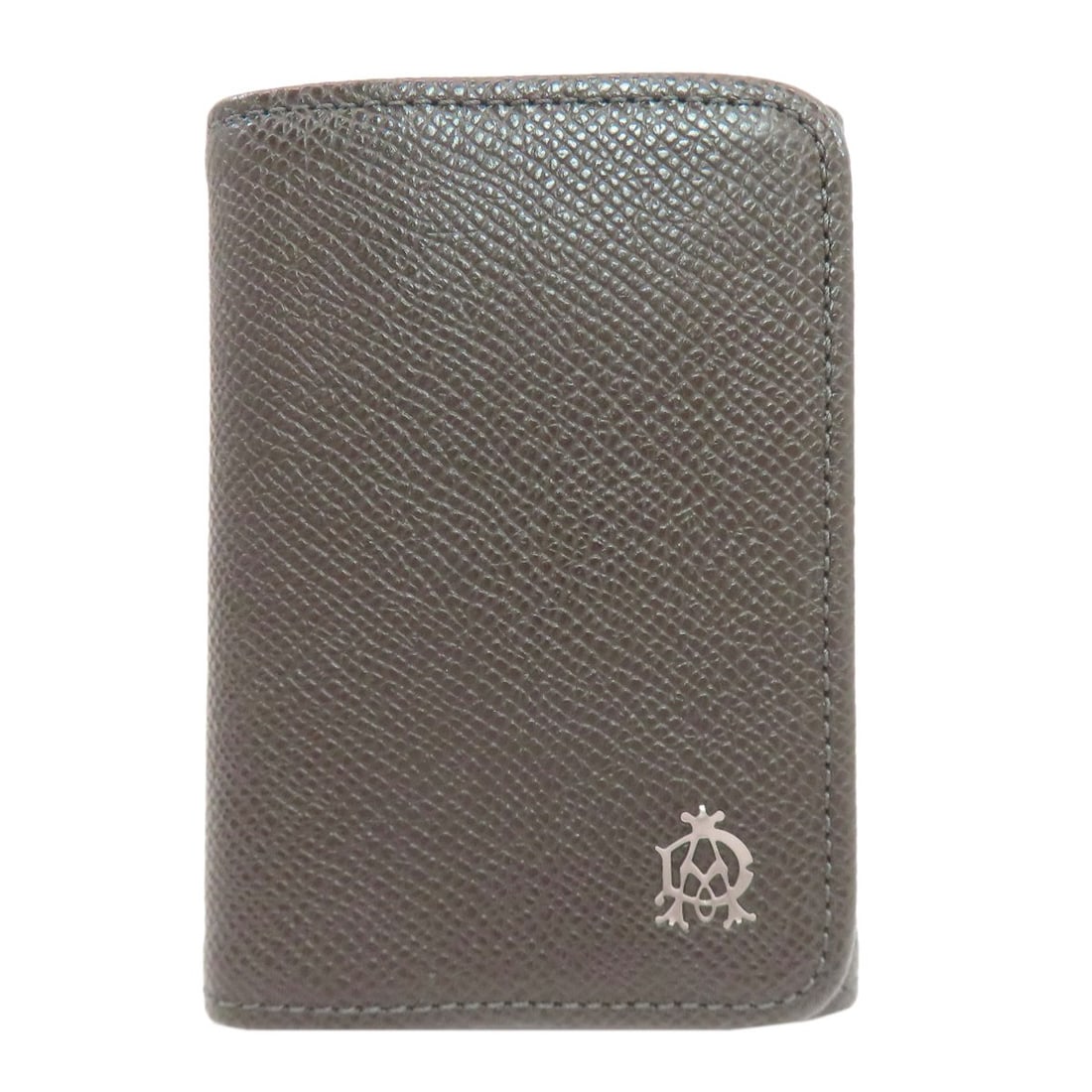 Dunhill leather key holder: Dunhill leather key holder A classic Dunhill leather key holder in dark brown, crafted from high-quality Italian leather that adds a touch of sophistication to any room. Its understated design makes