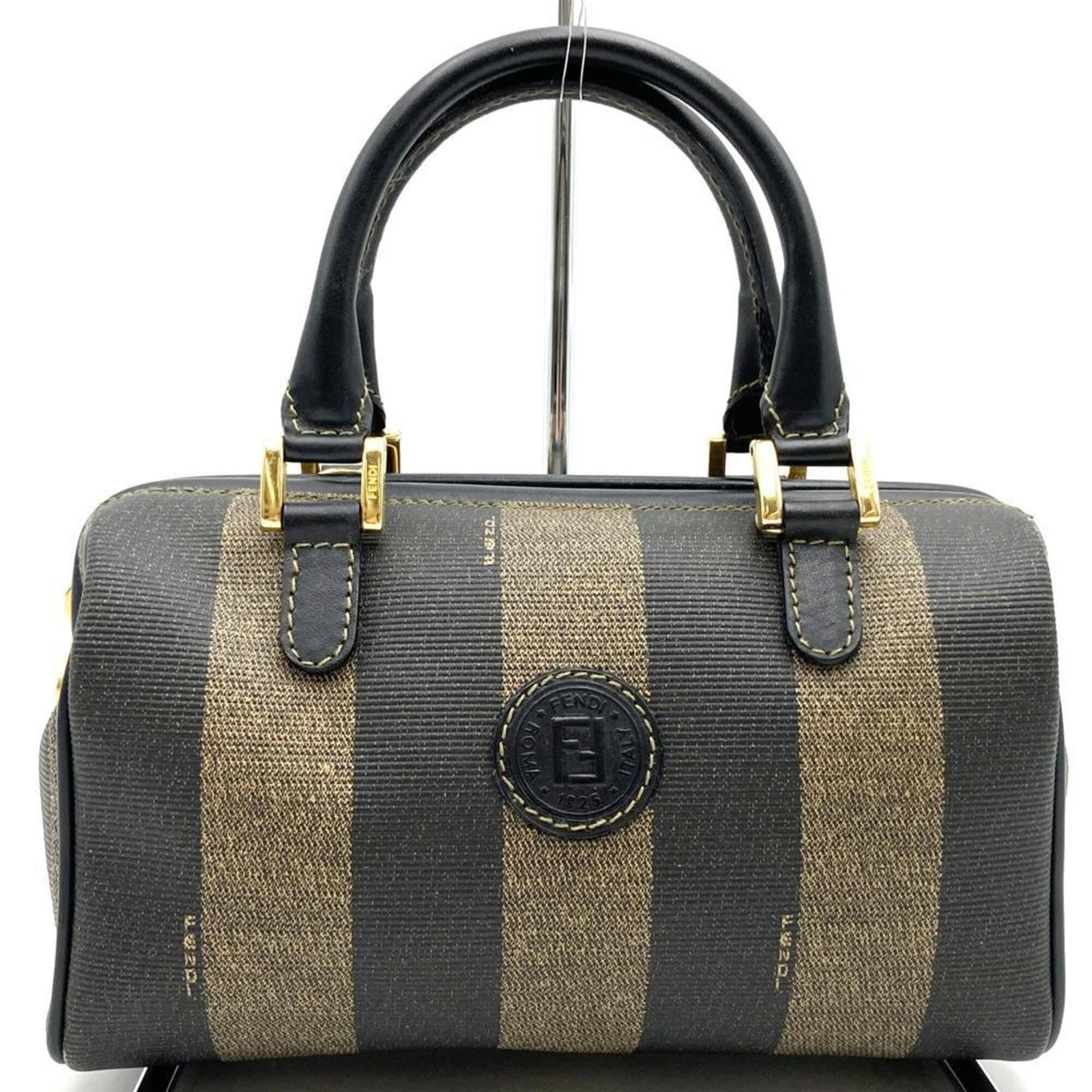 Fendi Handbag Pvc, Leather: Fendi Handbag Pvc, Leather A luxurious Fendi handbag with a unique blend of PVC and leather, offering a sleek and sophisticated look in rich brown tones. With its compact size and sturdy design, this