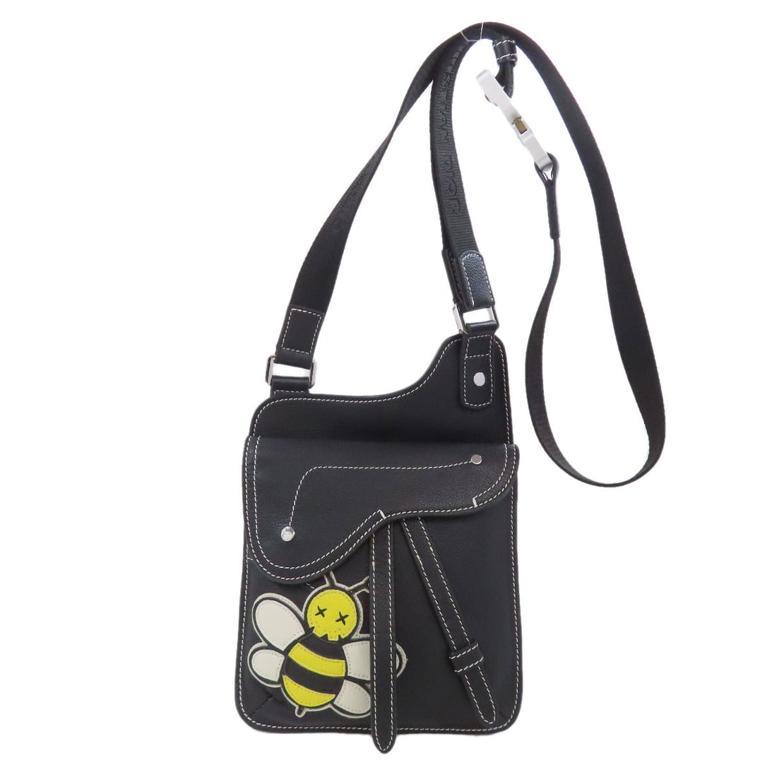 Christian Dior Calf Bee Saddle Bag: Christian Dior Calf Bee Saddle Bag The Christian Dior Calf Bee Saddle Bag is a sleek and sophisticated shoulder bag that exudes luxury with its high-quality calf exterior in rich black. This timeless 