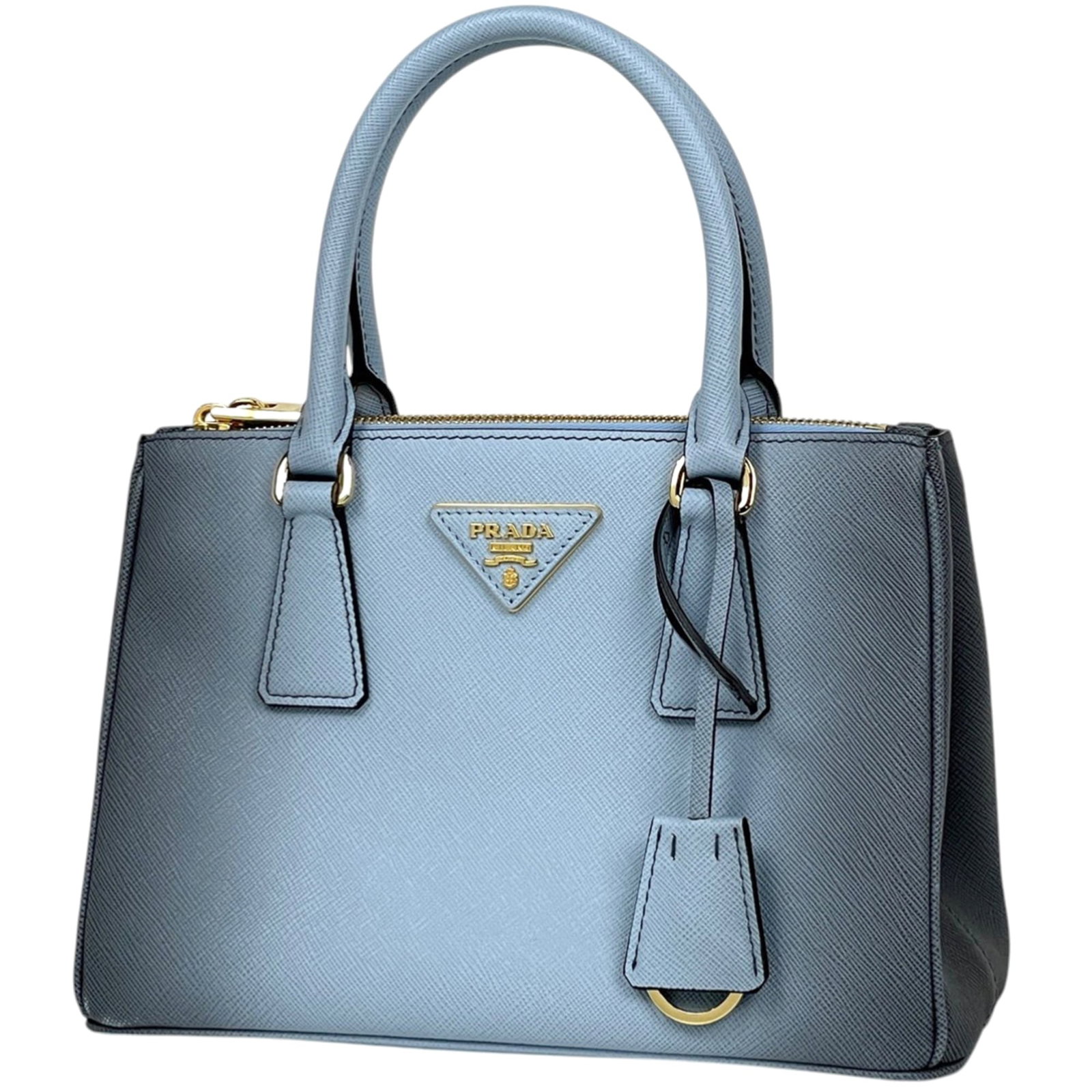 Prada leather shoulder bag: Prada leather shoulder bag A beautiful, pre-loved Prada leather shoulder bag in a stunning light blue hue, featuring high-quality craftsmanship and timeless design. With its classic shape and elegant