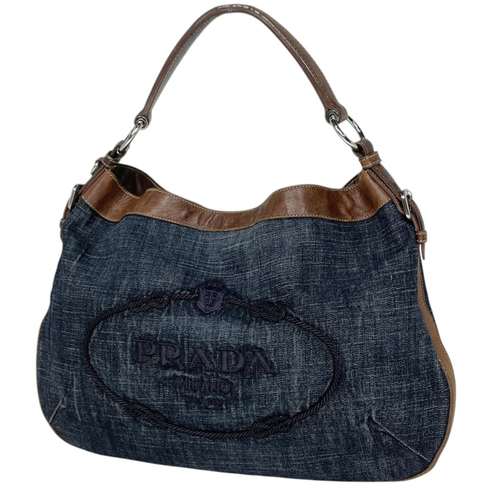Prada is a denim shoulder bag.: Prada is a denim shoulder bag. A stylish and versatile denim shoulder bag from Prada, perfect for adding an edgy touch to any outfit. With its classic design and premium materials, this blue or brown