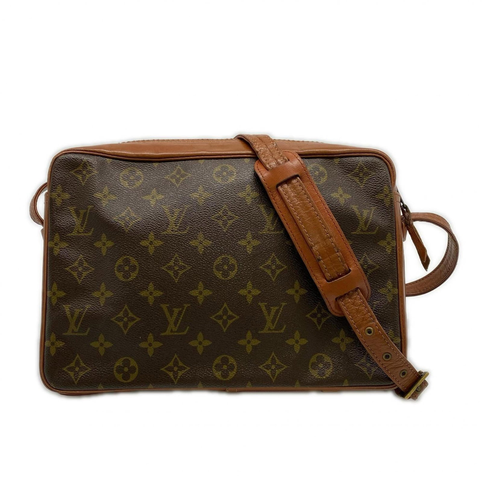 Louis Vuitton is a monogram bag.: Louis Vuitton is a monogram bag. A timeless piece from the iconic Louis Vuitton brand, this monogram bag boasts the signature LV pattern in rich brown hues. With its spacious interior and adjustable s