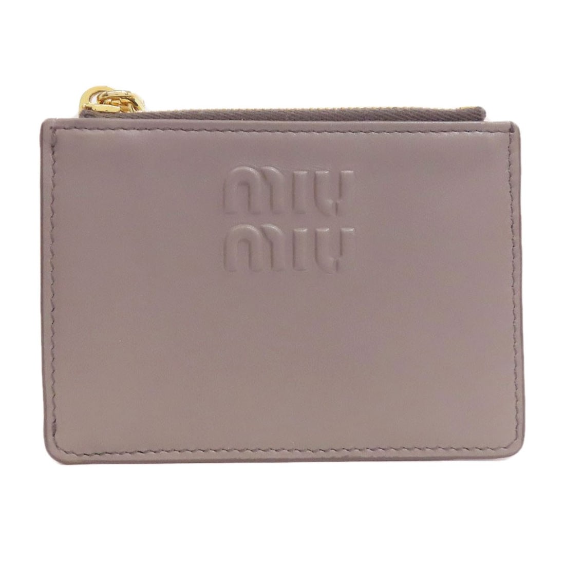 Miumiu leather card case: Miumiu leather card case Elevate your daily essentials with this sleek MIUMIU leather card case, crafted from high-quality Italian leather in a timeless gray hue. Its understated design makes it the