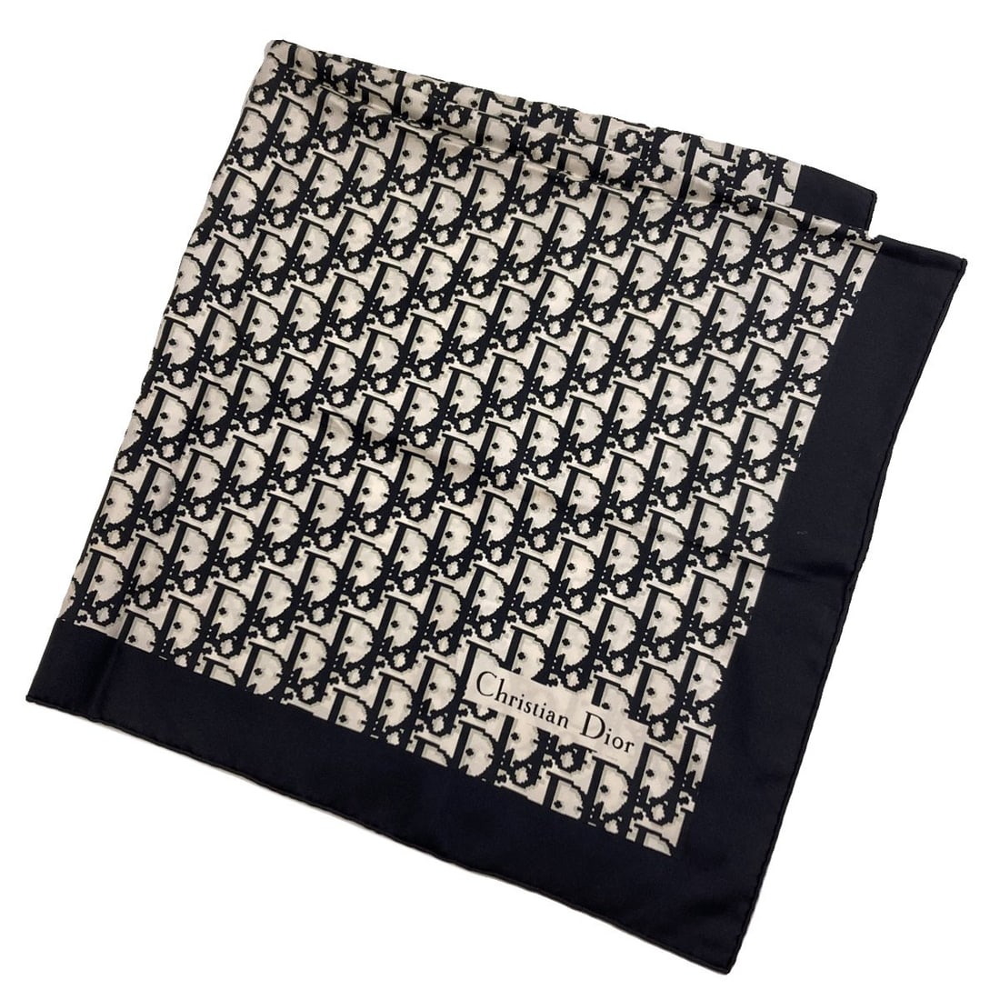 Christian Dior silk scarf with trotter pattern: Christian Dior silk scarf with trotter pattern Elevate your style with the iconic Christian Dior silk scarf, boasting a timeless trotter pattern in sleek black and white hues. Made from luxurious