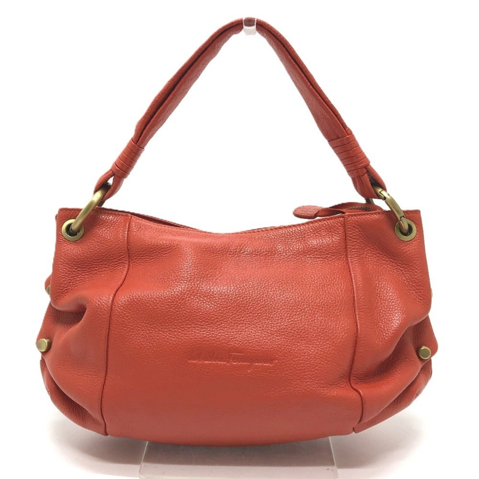 Salvatore Ferragamo Handbag, Shoulder Bag Leather: Salvatore Ferragamo Handbag, Shoulder Bag Leather A vibrant orange leather shoulder bag from the iconic Salvatore Ferragamo brand, boasting classic Italian design and premium quality construction.