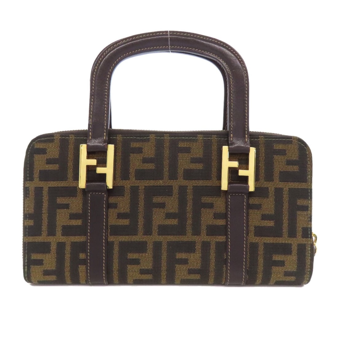 Fendi canvas handbag with zucca pattern: Fendi canvas handbag with zucca pattern Elevate your style with the iconic Fendi canvas handbag, boasting a timeless zucca pattern in rich brown hues that add depth and sophistication to any outfit. C