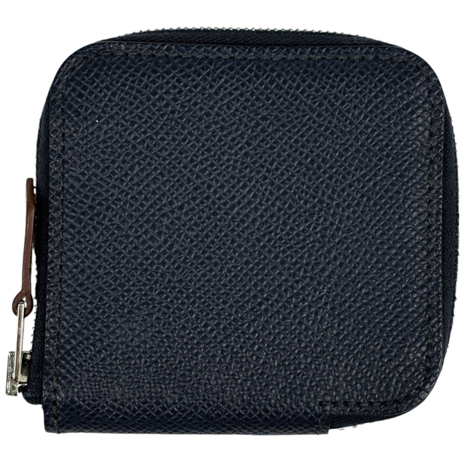 Hermes leather coin case: Hermes leather coin case A classic Hermes leather coin case, exuding timeless elegance with its navy hue and premium leather construction. With its spacious interior and sturdy design, this compact