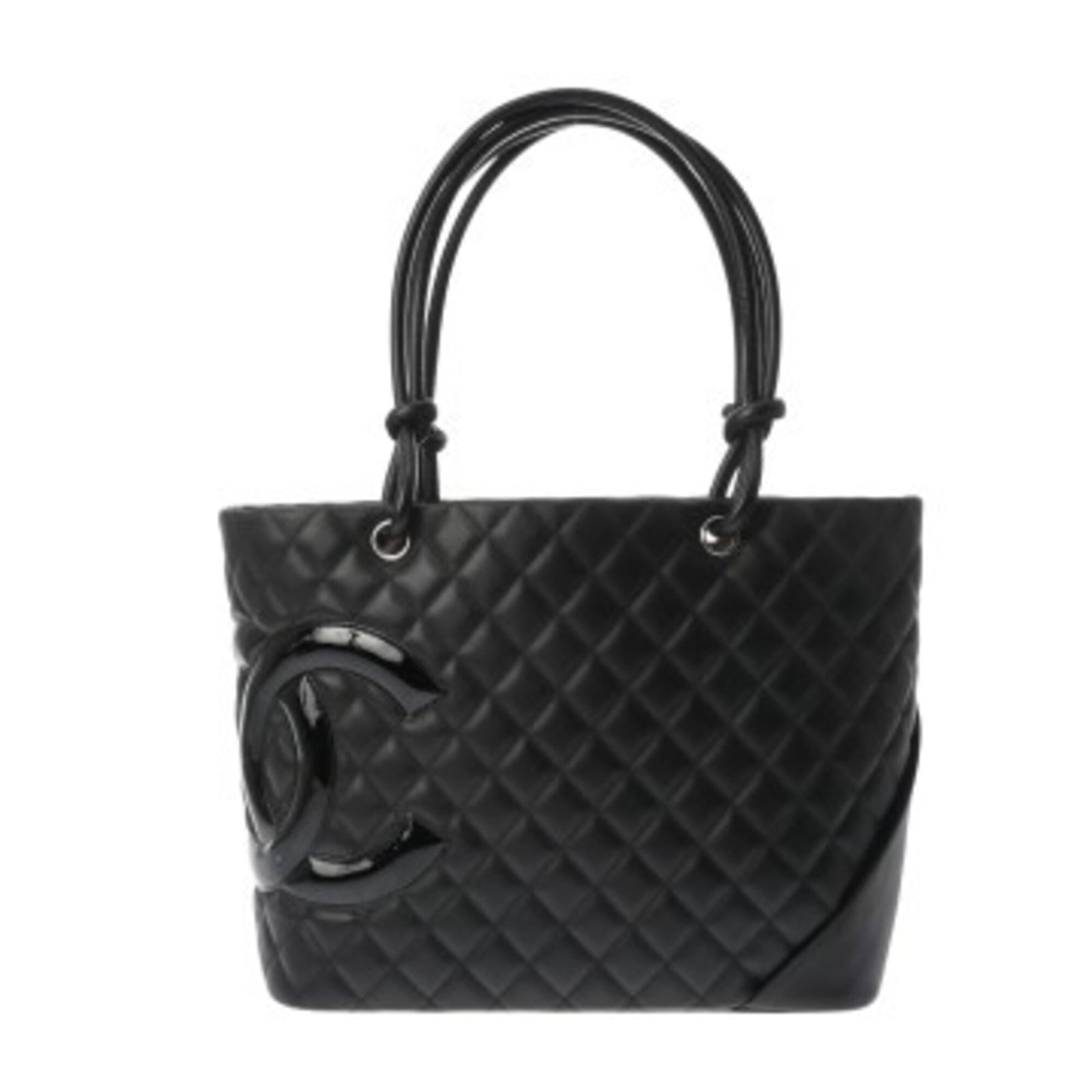 Chanel Tote Bag Leather: Chanel Tote Bag Leather A timeless Chanel tote bag in sleek black leather, adorned with silver hardware, exudes classic sophistication. With its spacious interior and sturdy calfskin construction,
