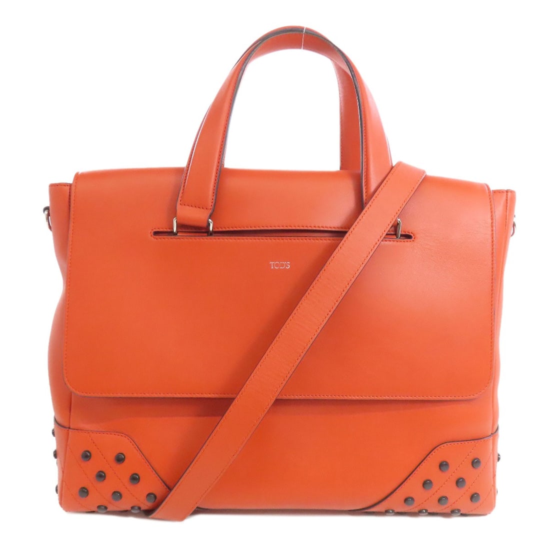 Leather Tods Studs Tote Bag: Leather Tods Studs Tote Bag Elevate your daily style with the vibrant Orange Tods Studs Tote Bag, crafted from rich Italian leather and boasting sleek stud details that add a touch of sophistication