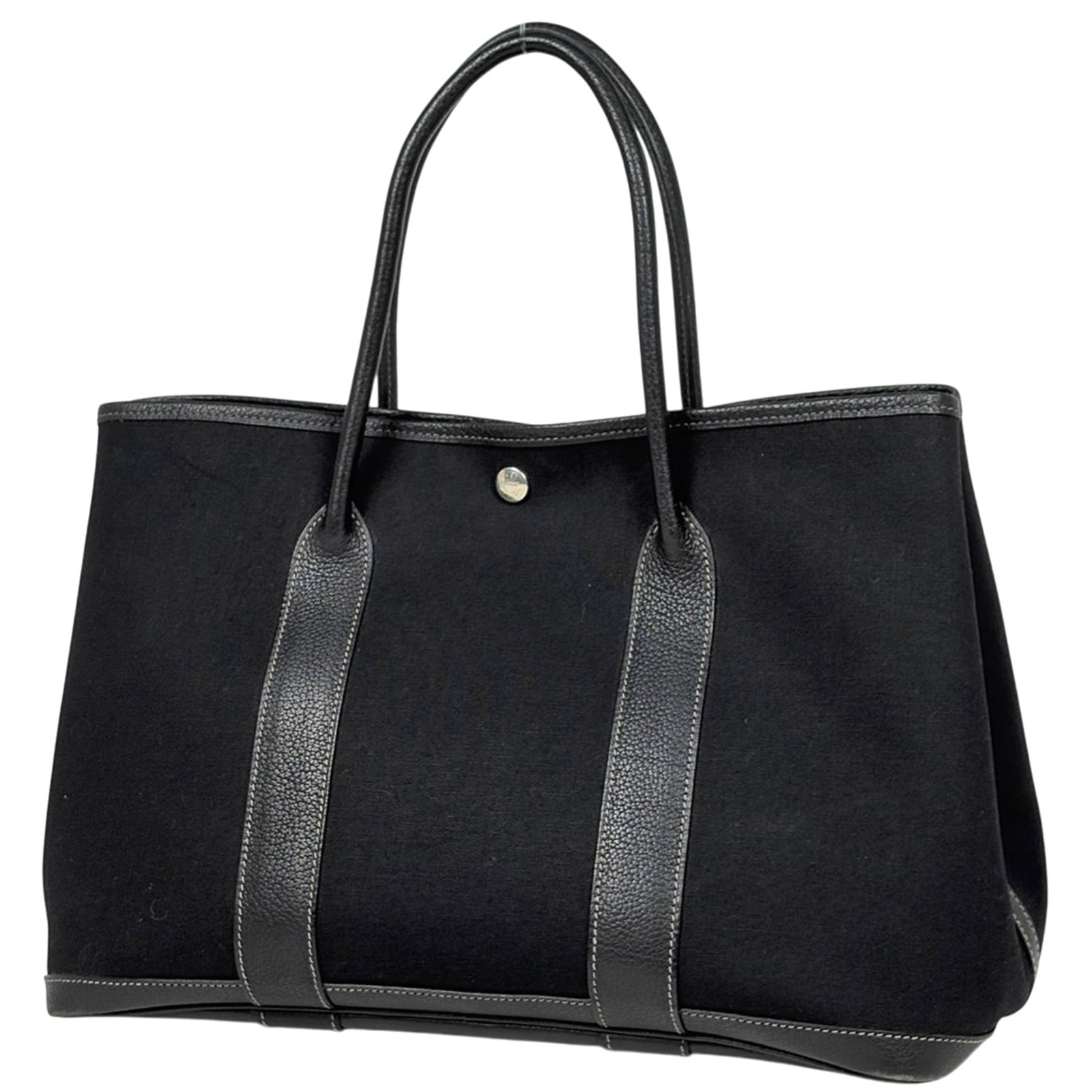 Hermes Handbag, Tote Bag Toile Officier, Leather: Hermes Handbag, Tote Bag Toile Officier, Leather A rare opportunity to own a pre-owned Hermes Tote Bag Toile Officier in exquisite black leather, boasting the iconic brand's signature style and