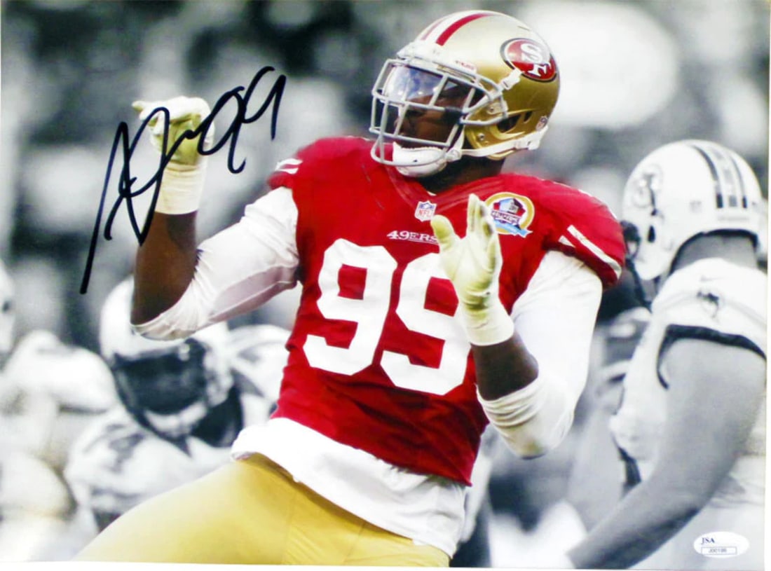 Aldon Smith Autographed 11x14 Photo (JSA): Aldon Smith Autographed 11x14 Photo (JSA) Get ready to own a piece of NFL history with this authentic 11x14 photo of Aldon Smith, signed by the legendary defensive end himself. Packed and authenticate