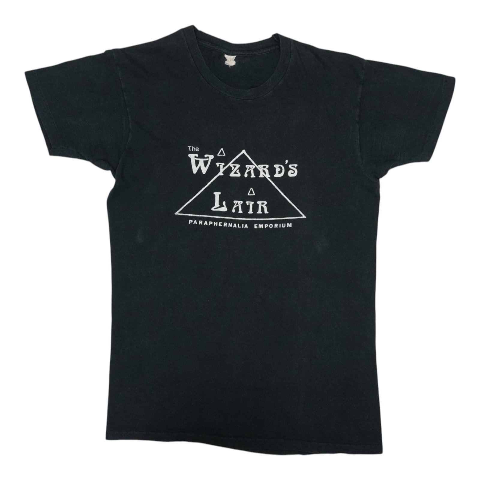 The Wizard's 1970s Shirt from The Lair of Paraphernalia Emporium: The Wizard's 1970s Shirt from The Lair of Paraphernalia Emporium Score big with this ultra-rare 1970s The Wizard's Lair Paraphernalia Emporium shirt, boasting a classic black design and authentic vint