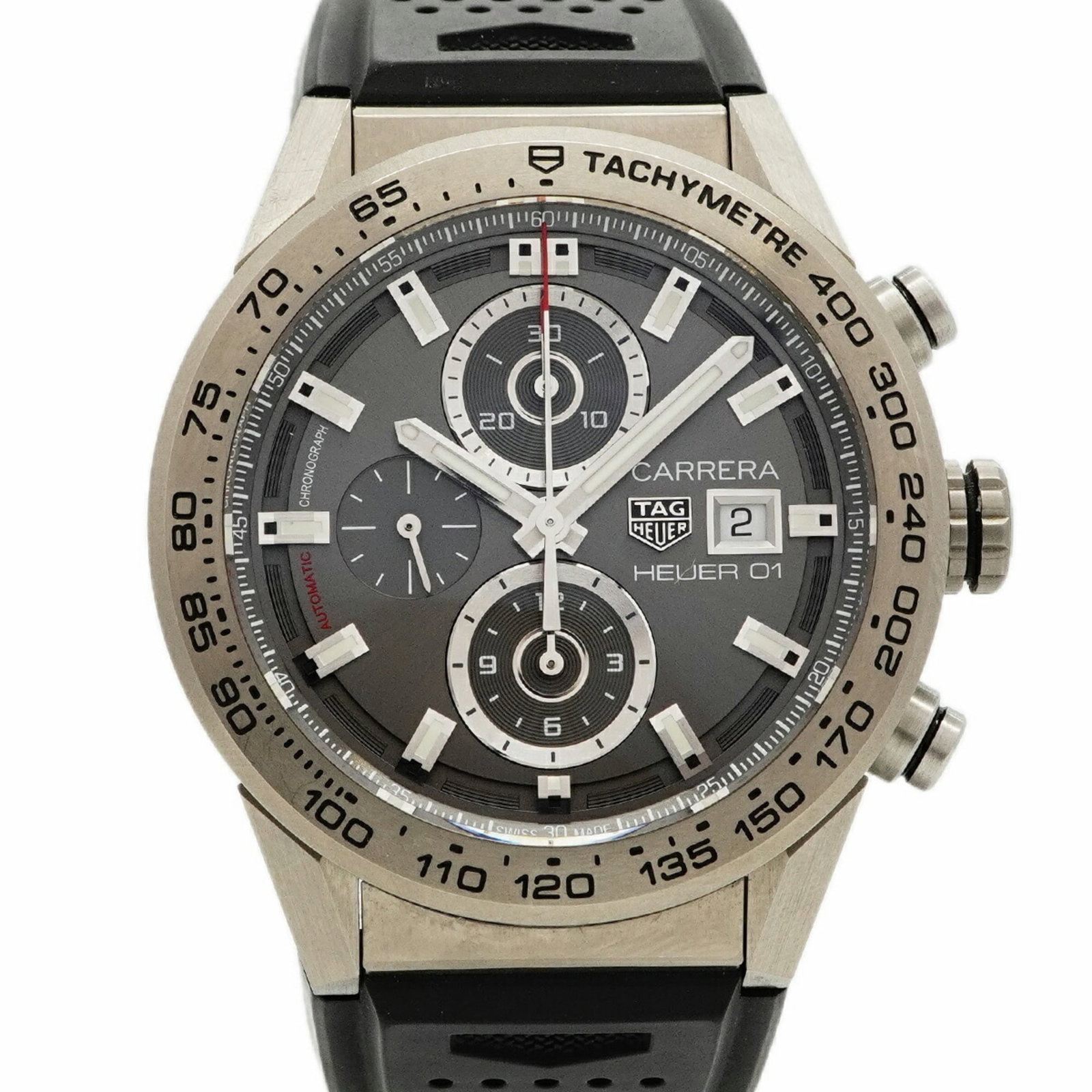 Wristwatch by Tag Heuer: Wristwatch by Tag Heuer A pre-owned Tag Heuer wristwatch with a 43.3mm case diameter and rubber band, this stylish timepiece boasts a sleek gray dial that exudes sophistication. With its durable