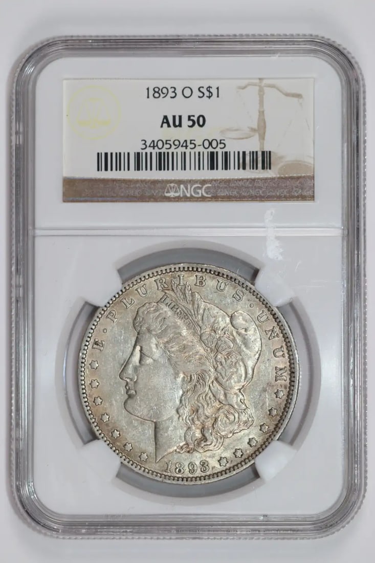 1893-O MORGAN DOLLAR NGC AU50: 1893-O MORGAN DOLLAR NGC AU50 Experience the rich history of the American West with this 1893-O Morgan Dollar, certified by the Numismatic Guaranty Corporation (NGC) as AU 50. Minted in New Orleans, o