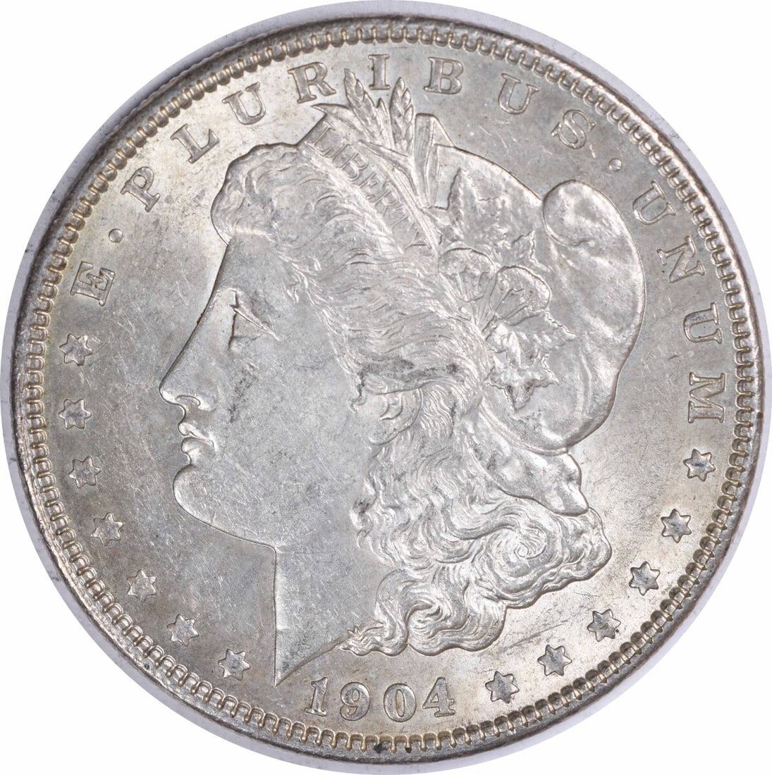 1904 Morgan Silver Dollar AU Slider Uncertified: 1904 Morgan Silver Dollar AU Slider Uncertified A beautifully preserved 1904 Morgan Silver Dollar, graded AU and certified as circulated, boasts stunning silver content with its 90% composition and
