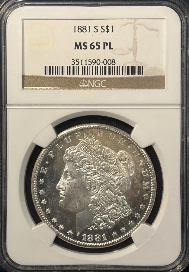 1881-S MORGAN DOLLAR NGC MS65 PL: 1881-S MORGAN DOLLAR NGC MS65 PL Experience the beauty of the 1881-S Morgan Dollar, graded MS65 by the Numismatic Guaranty Corporation (NGC). This stunning coin is certified as uncirculated and featur