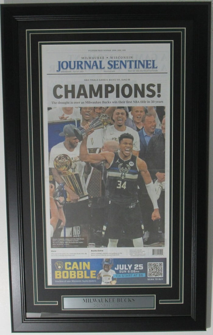 Milwaukee Bucks are 2021 NBA Champs in framed newspaper. (1 of 2)