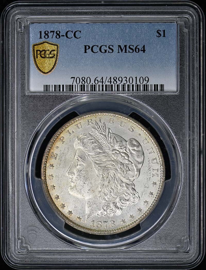1878-CC $1 Morgan Dollar PCGS MS64: 1878-CC $1 Morgan Dollar PCGS MS64 Experience the majesty of the 1878-CC Morgan Dollar, certified by PCGS as MS64. This stunning example boasts pristine condition and is one of the rarest dates in the