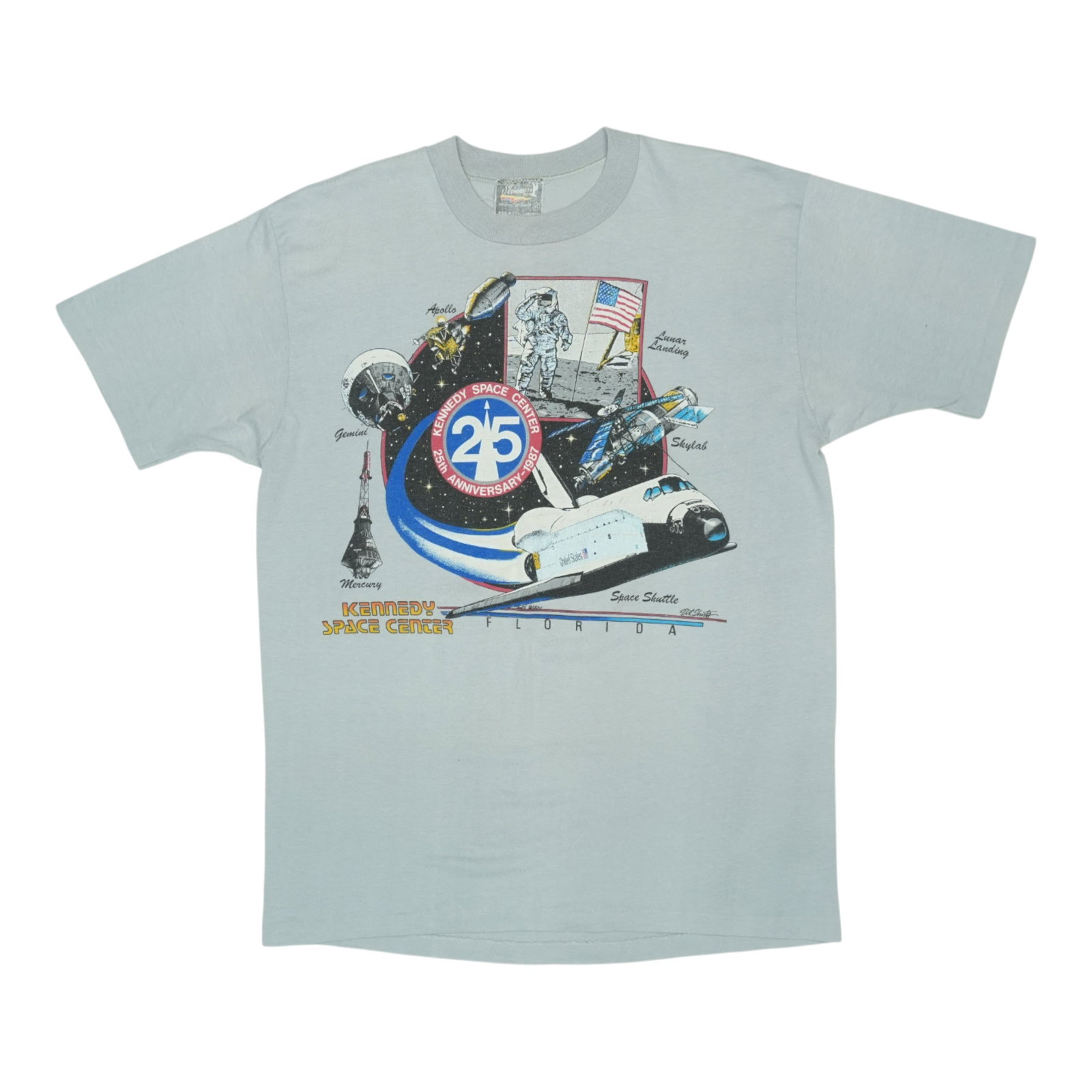 Kennedy Space Center 1980s Shirt: Kennedy Space Center 1980s Shirt Get ready to blast off into the 80s with this authentic vintage Kennedy Space Center NASA shirt! Made from high-quality 50/50 poly/cotton, this extra-large fit feature