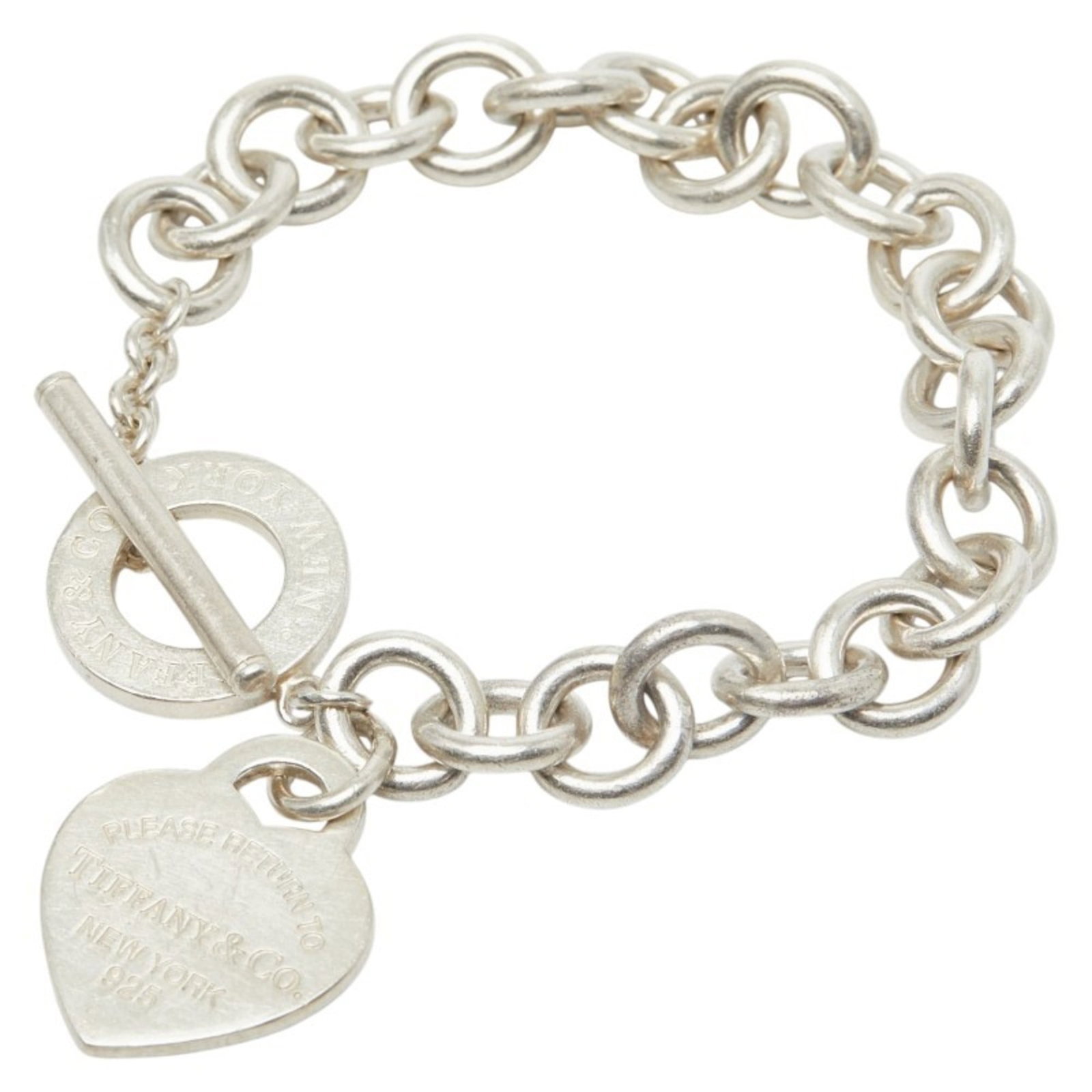 Tiffany Charm Bracelet Silver 925: Tiffany Charm Bracelet Silver 925 A delicate 16.5cm silver charm bracelet from Tiffany, crafted with sterling silver (925). This used piece shows signs of wear and minor imperfections, including