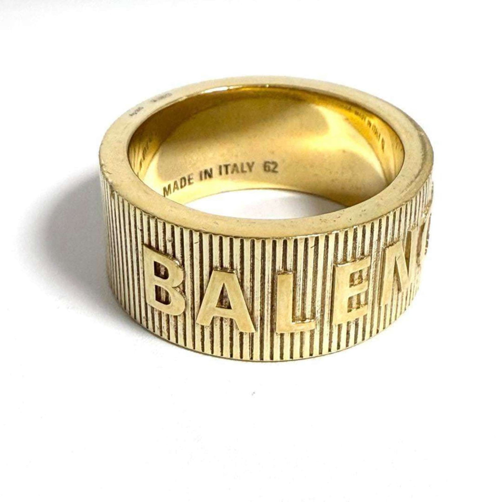 Band ring silver Balenciaga 925: Band ring silver Balenciaga 925 A sleek silver Balenciaga band ring, crafted from 925 sterling silver, adds a touch of luxury to any outfit with its understated elegance. This gold-toned ring boasts