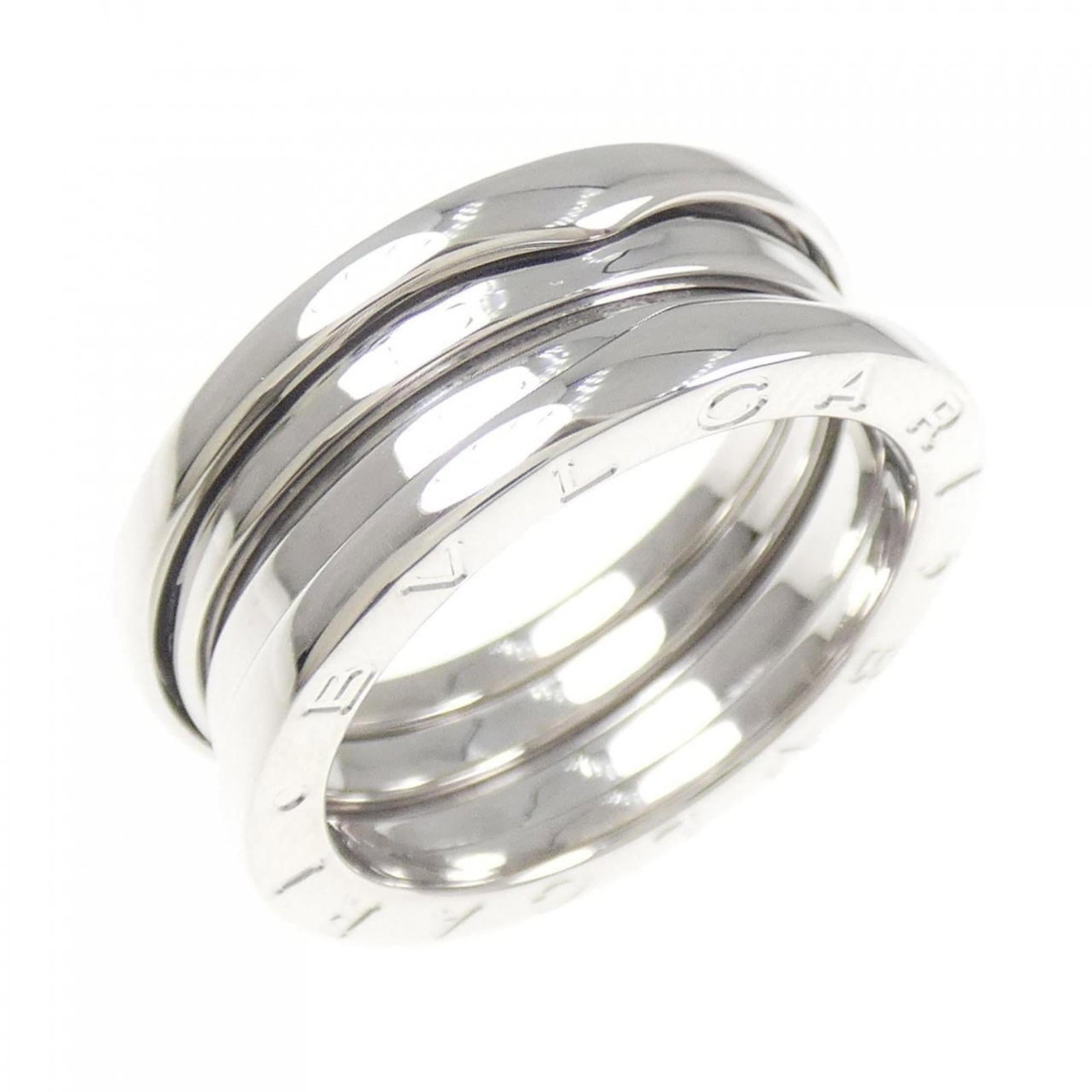 Bvlgari Band Ring White Gold (18K): Bvlgari Band Ring White Gold (18K) A sleek Bvlgari band ring in 18K white gold adds a touch of luxury to any outfit. This pre-owned, like-new condition ring boasts its original white gold material